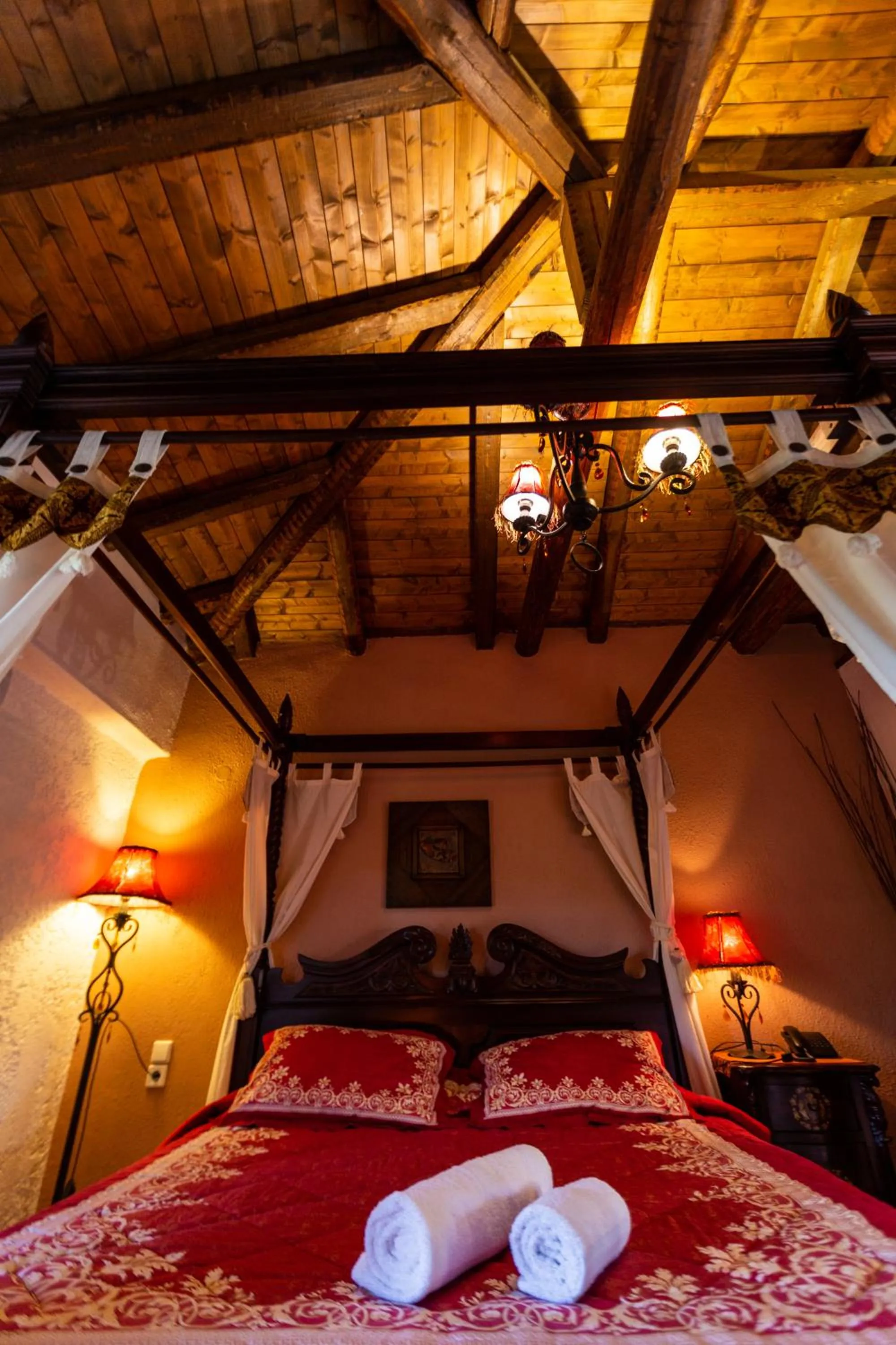 Bed in La Moara Boutique Hotel