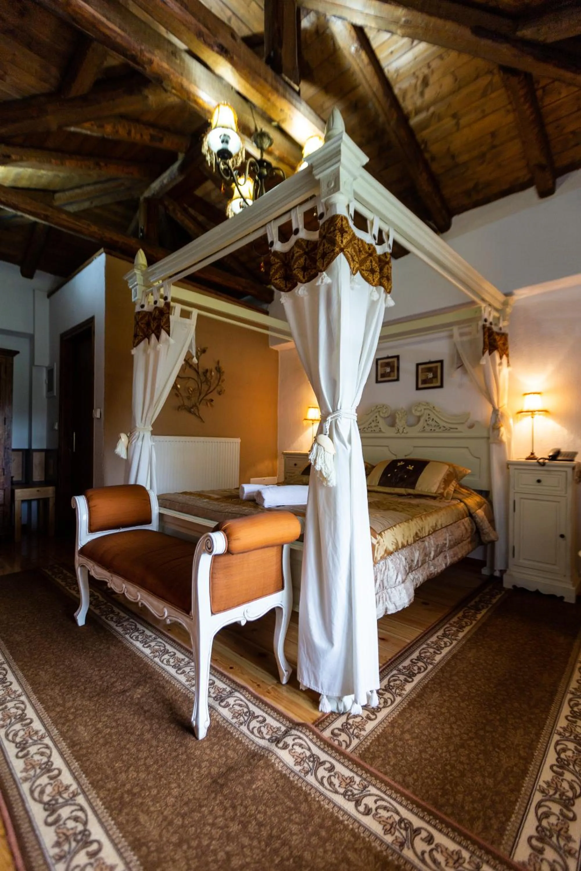 Bed in La Moara Boutique Hotel