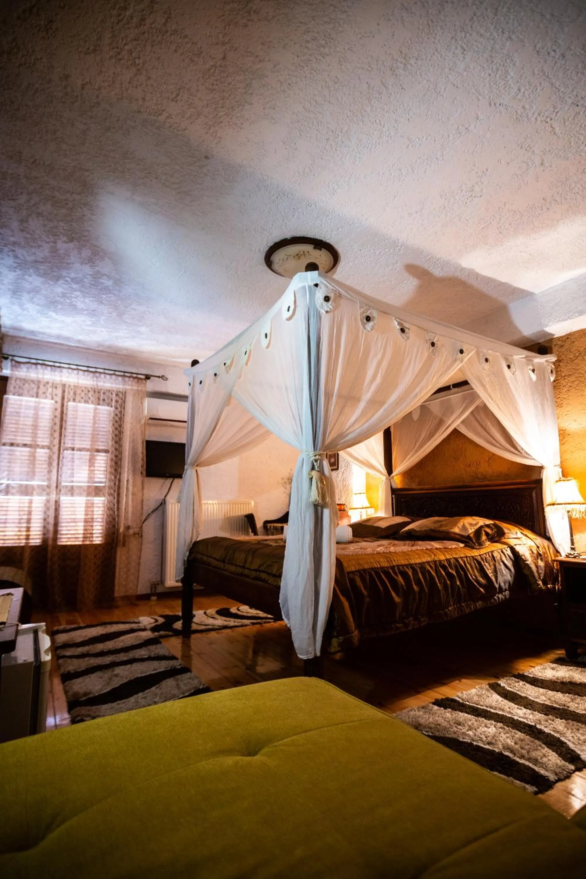 Bed in La Moara Boutique Hotel