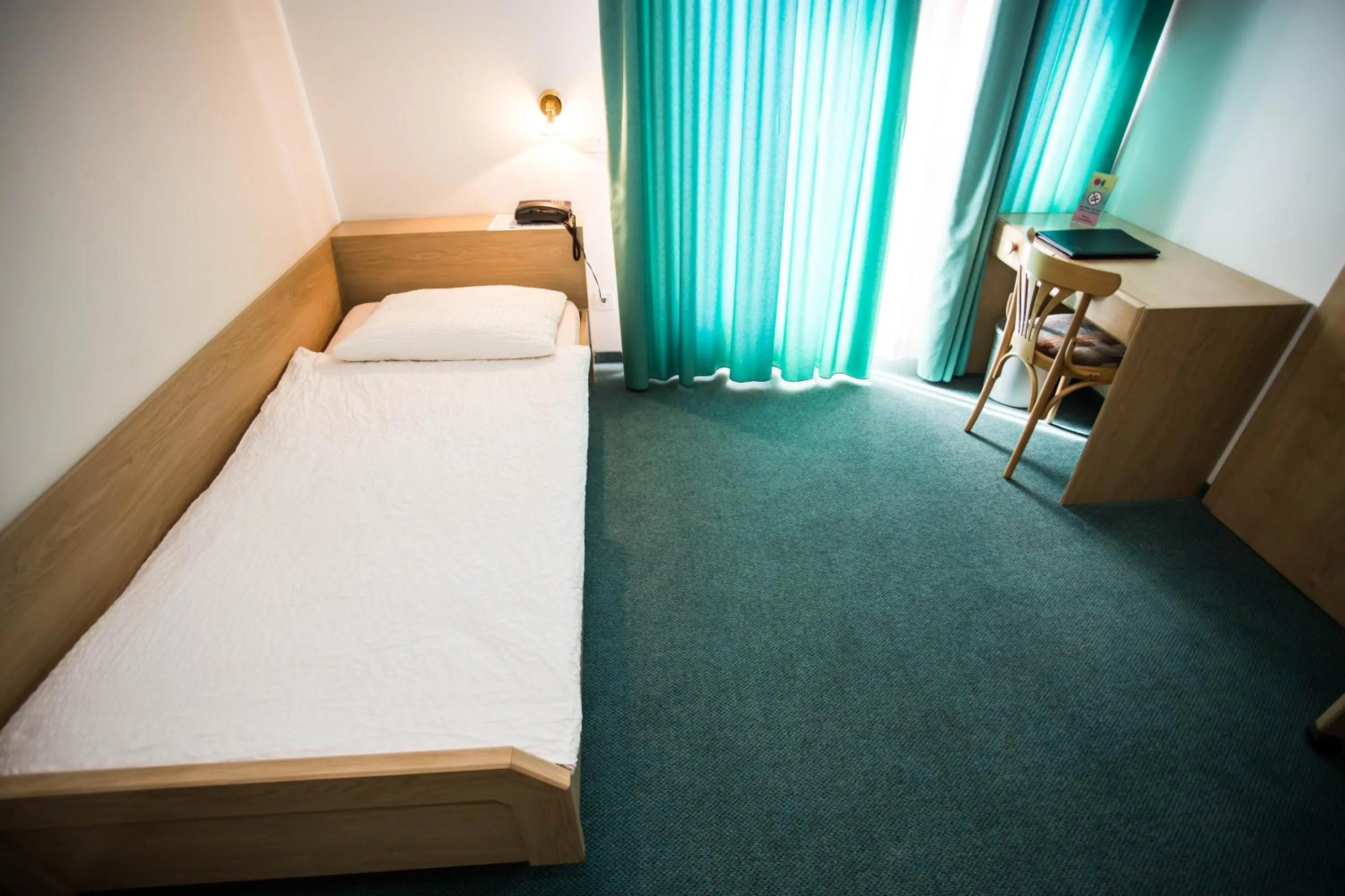 Bed in Hotel Olympica