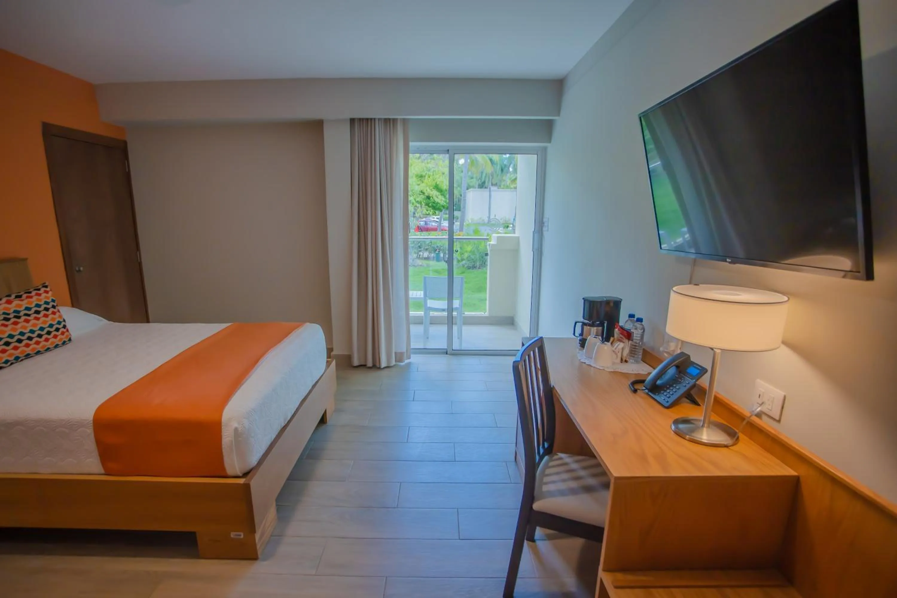 Bed in Coral Costa Caribe Beach Resort - All Inclusive