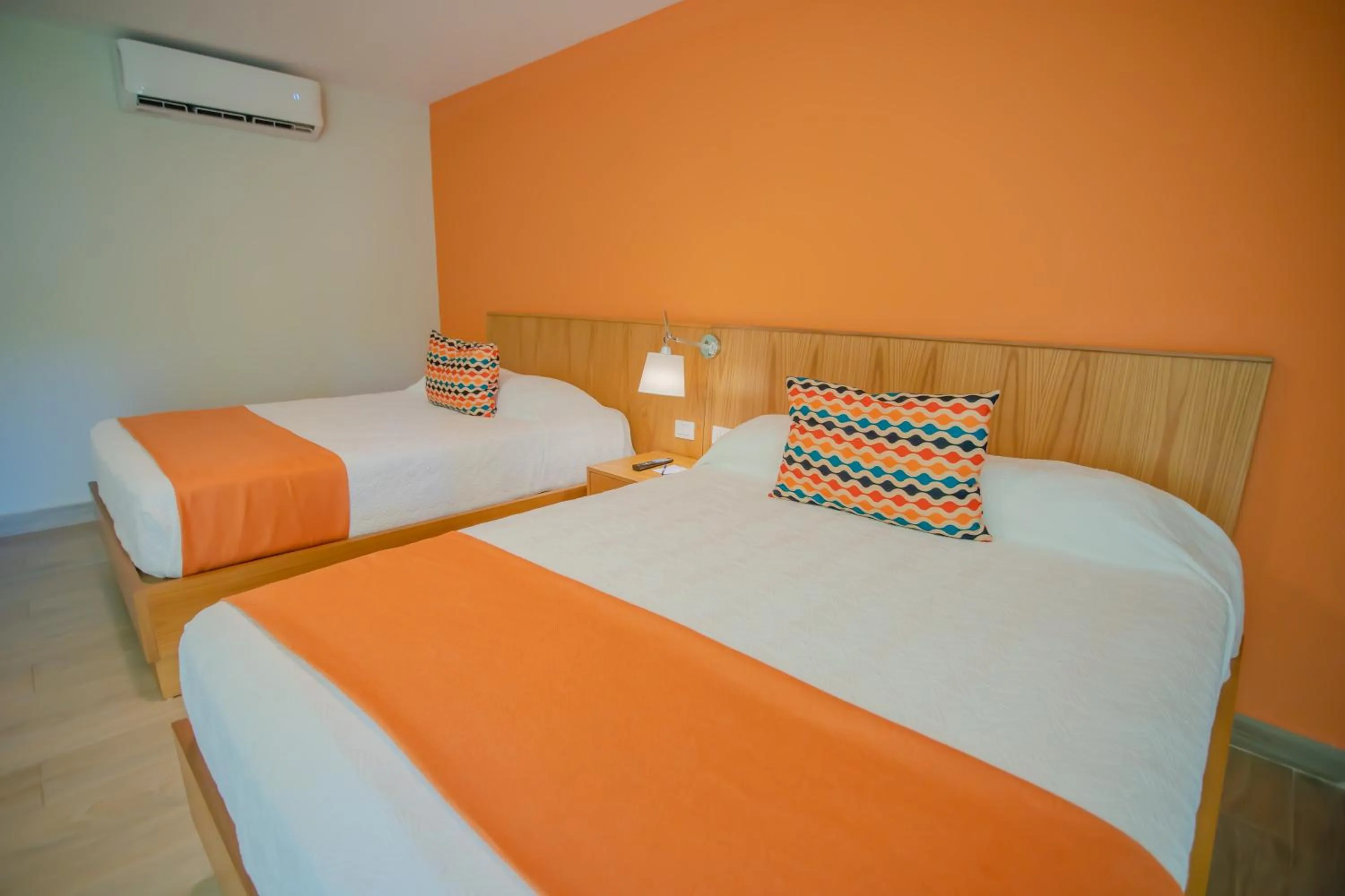 Bed in Coral Costa Caribe Beach Resort - All Inclusive