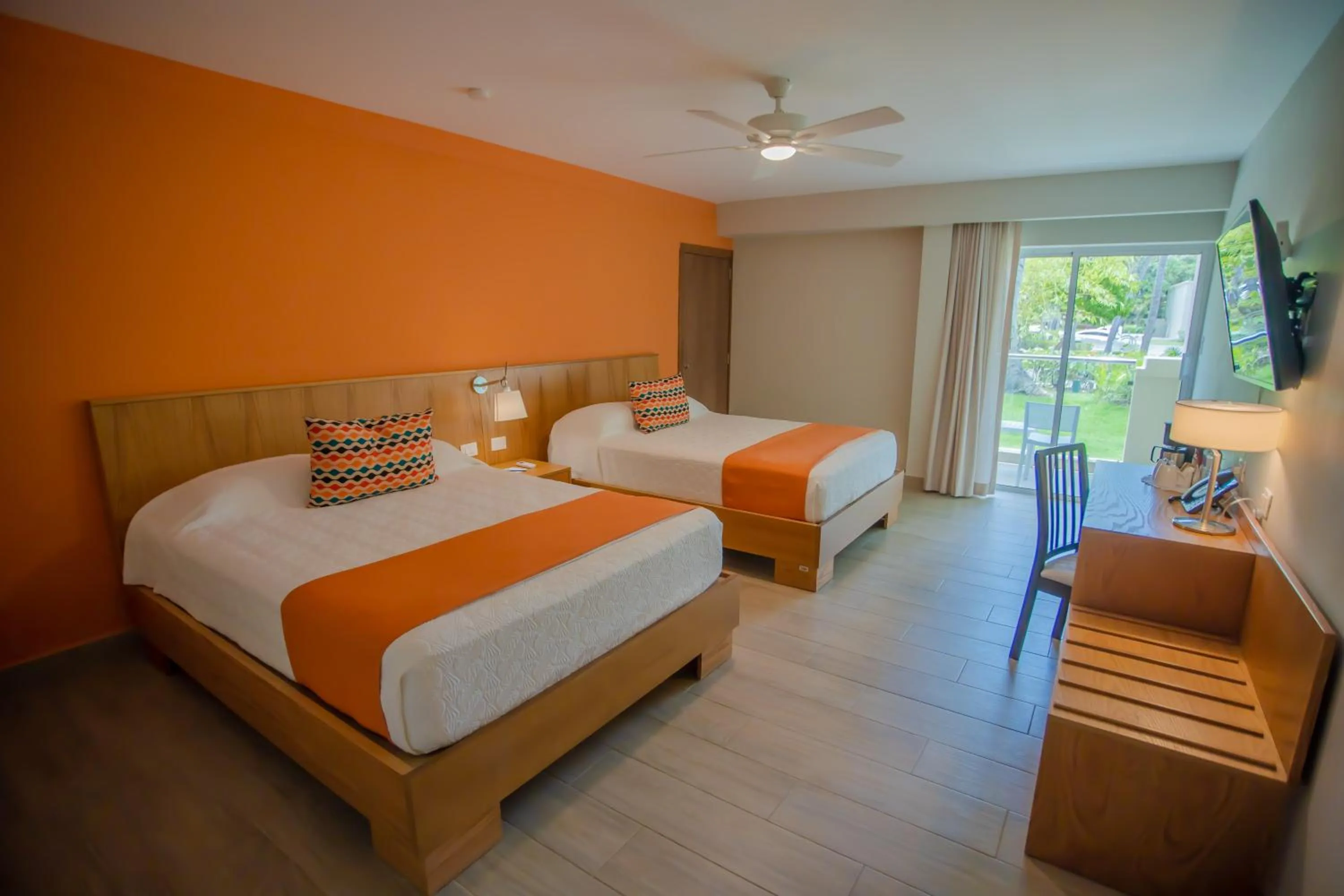Bed in Coral Costa Caribe Beach Resort - All Inclusive