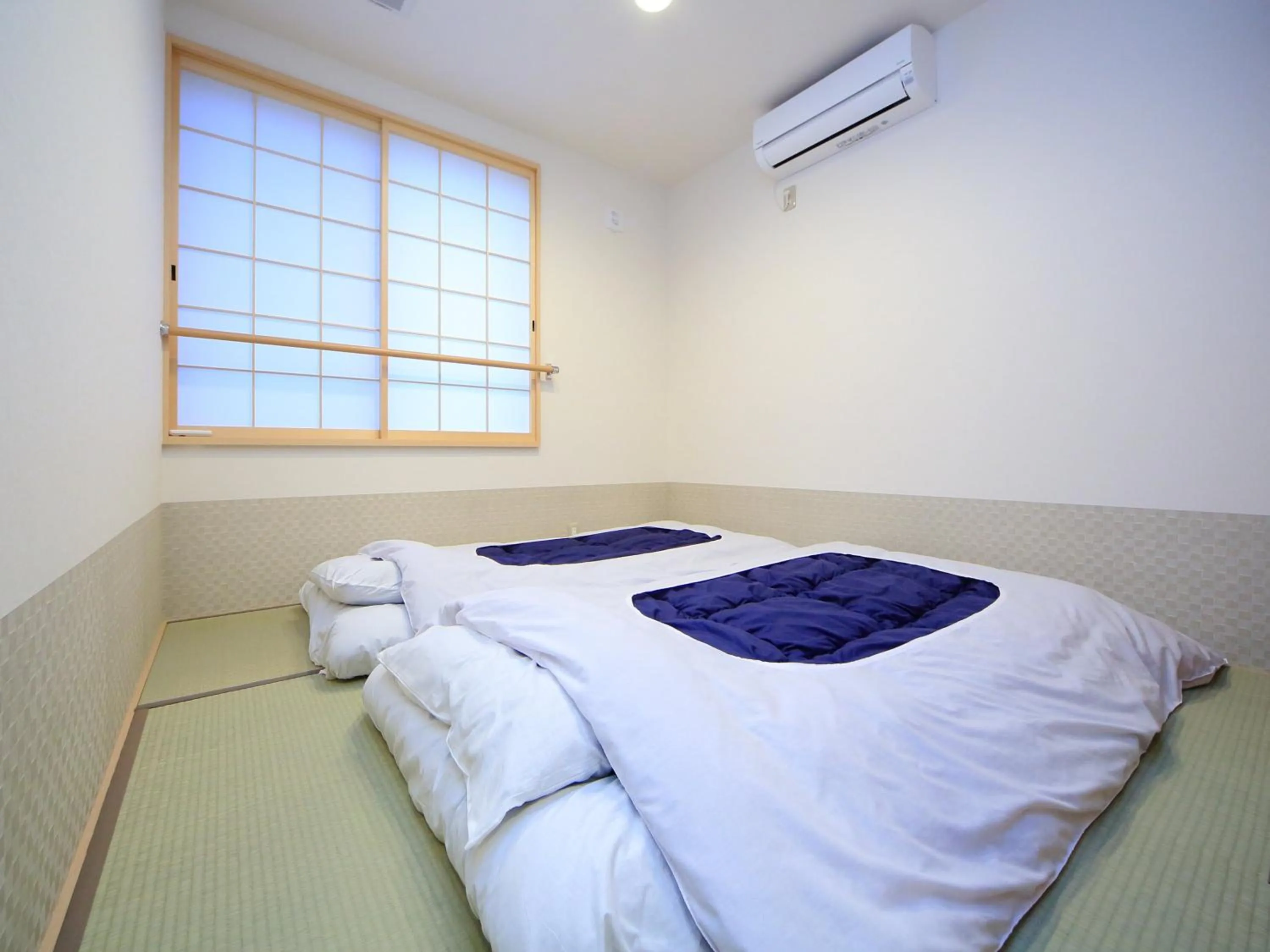 Bed in Kamon Inn Hieijocho