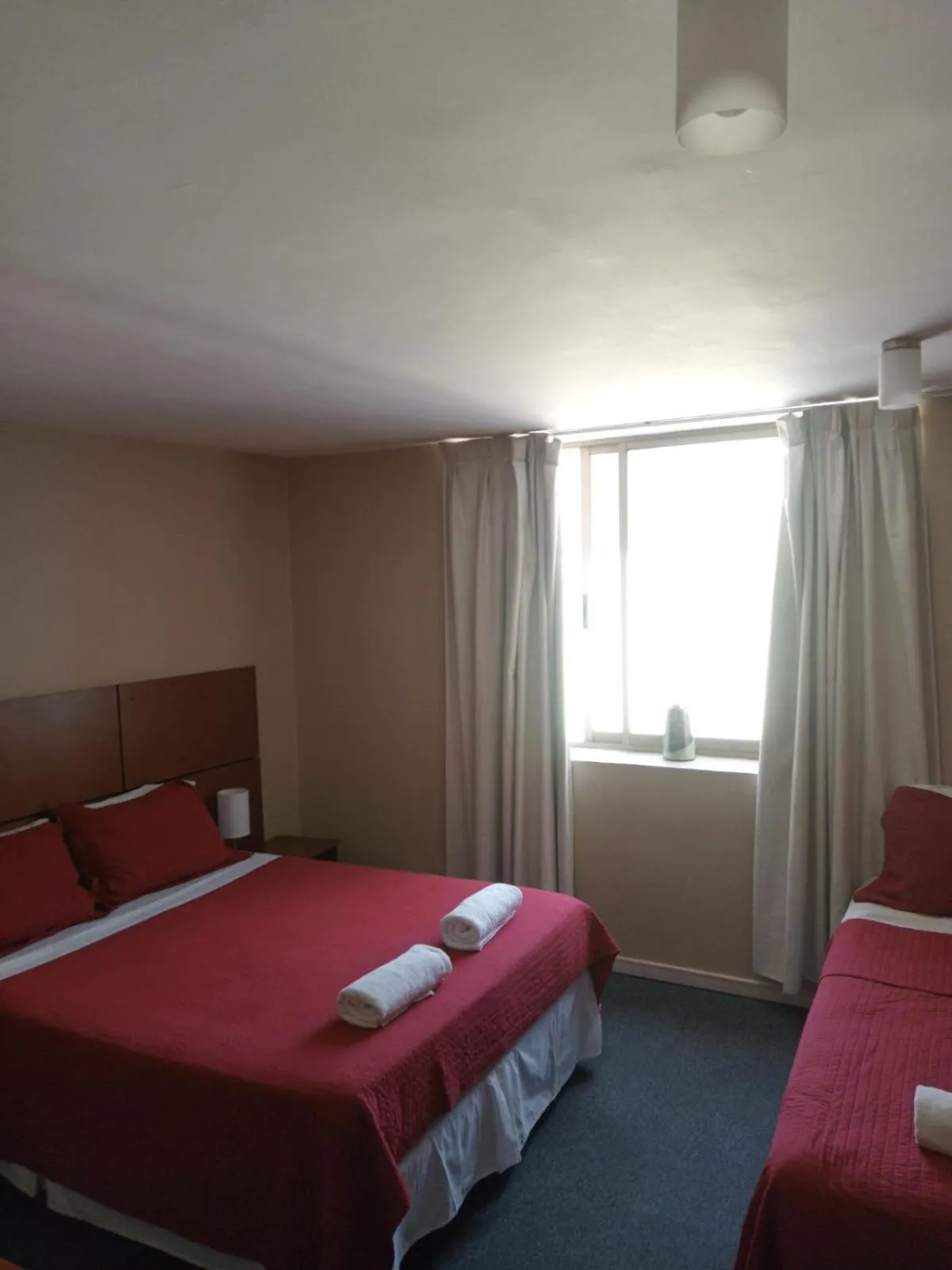 Bed in Origen Apart-Hotel