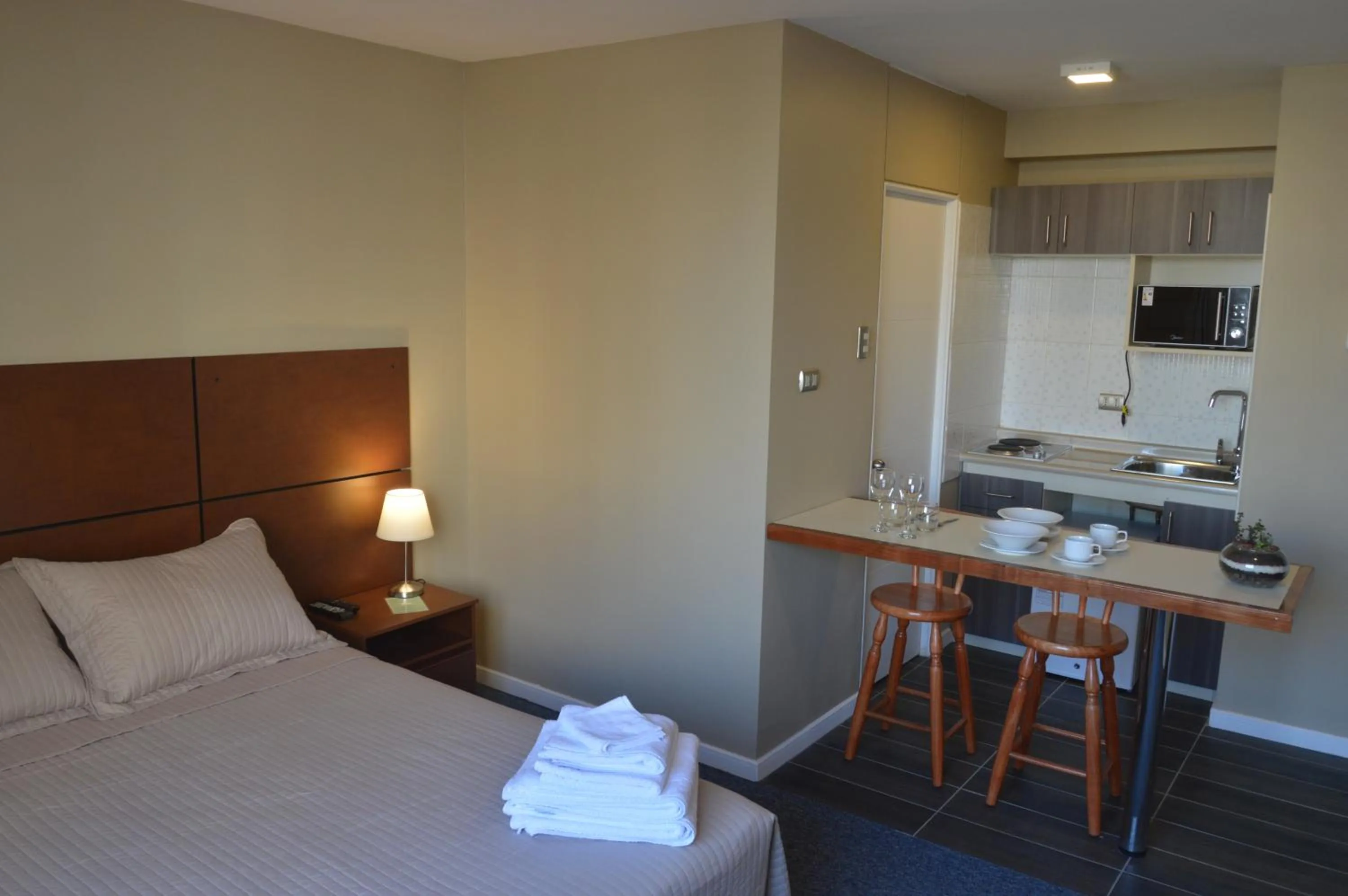 Bed in Origen Apart-Hotel