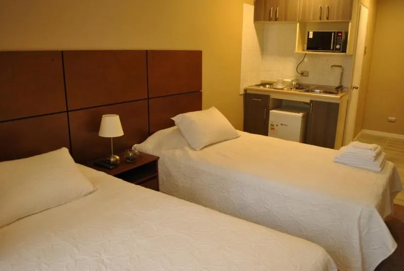 Bed in Origen Apart-Hotel