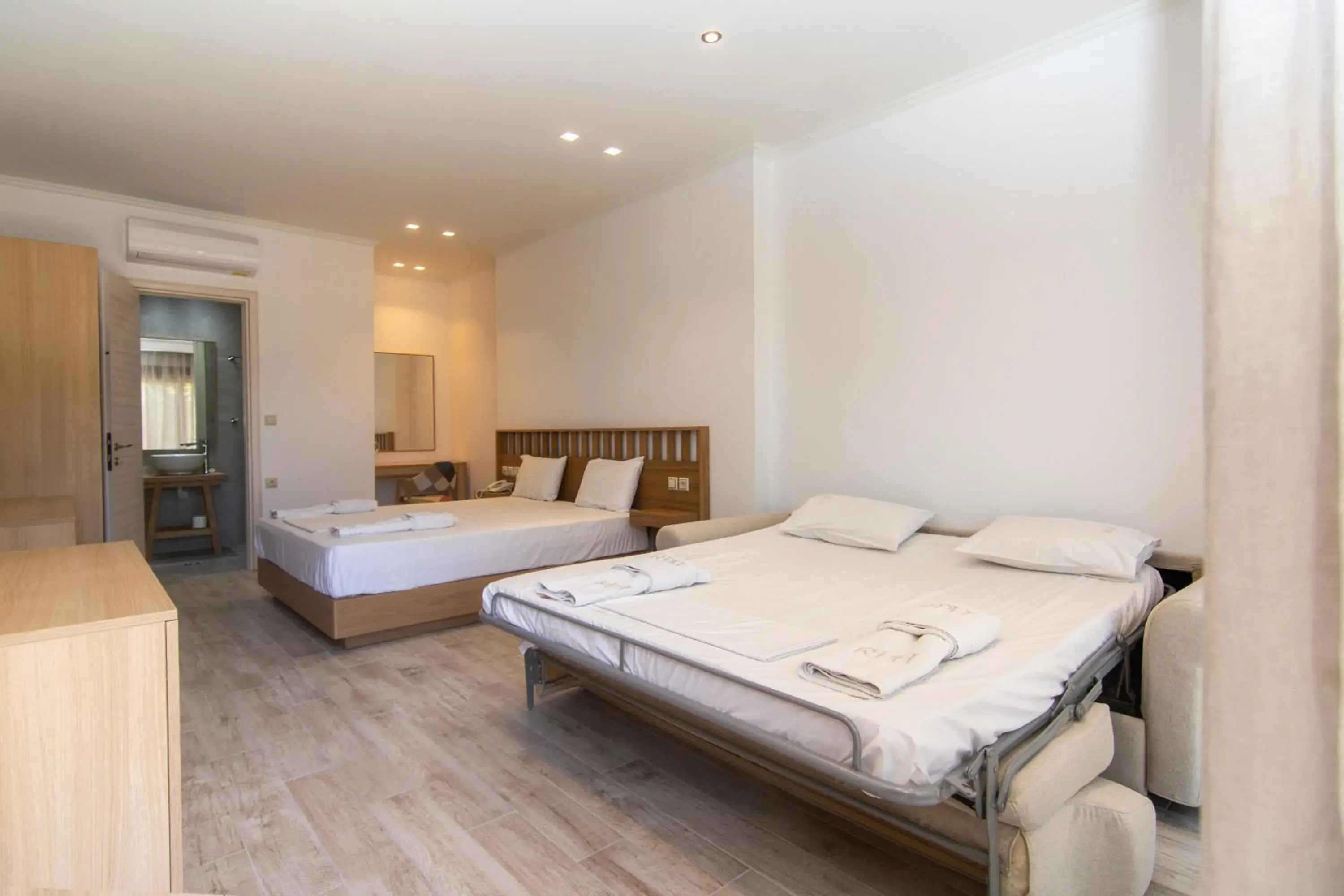 Quadruple Room with Garden View in Riviera Perdika Hotel Quadruple Room with Garden View in Riviera Perdika Hotel