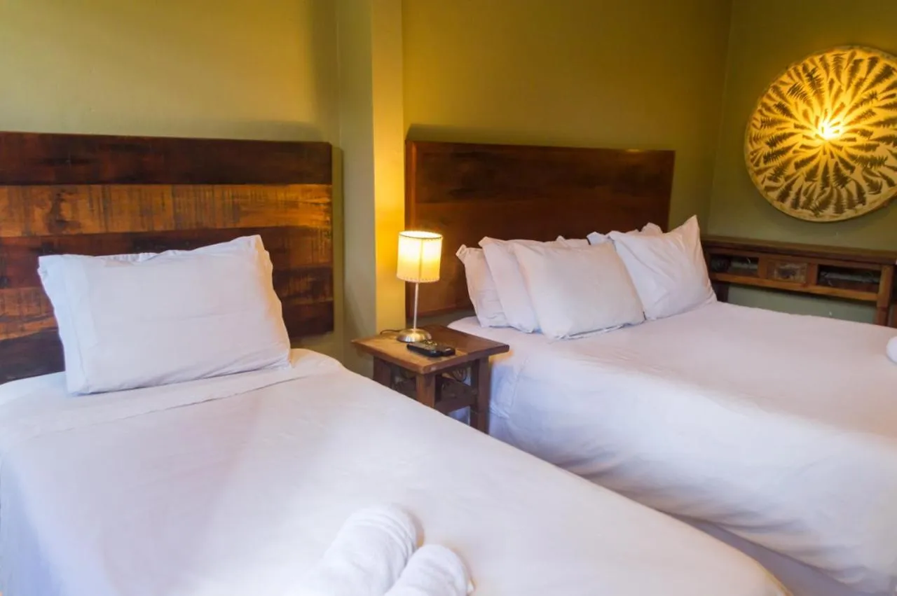 Bed in Pousada Papyrus