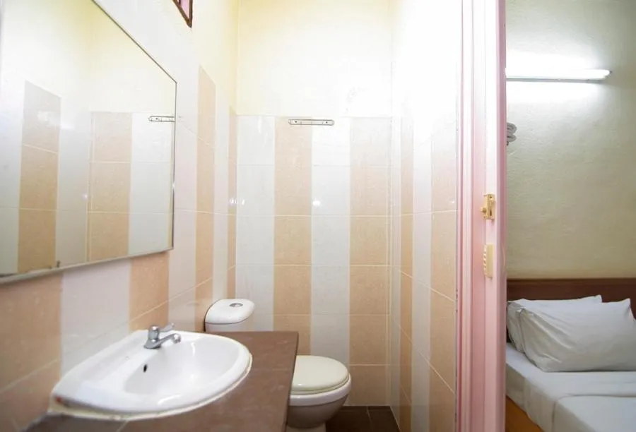 Toilet, Bed in Anggerik Lodging