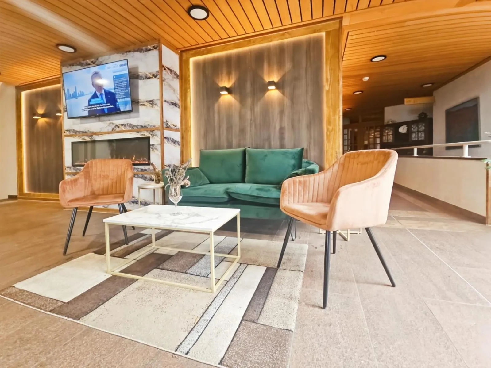 Communal lounge/ TV room in Hotel Aeschi Park