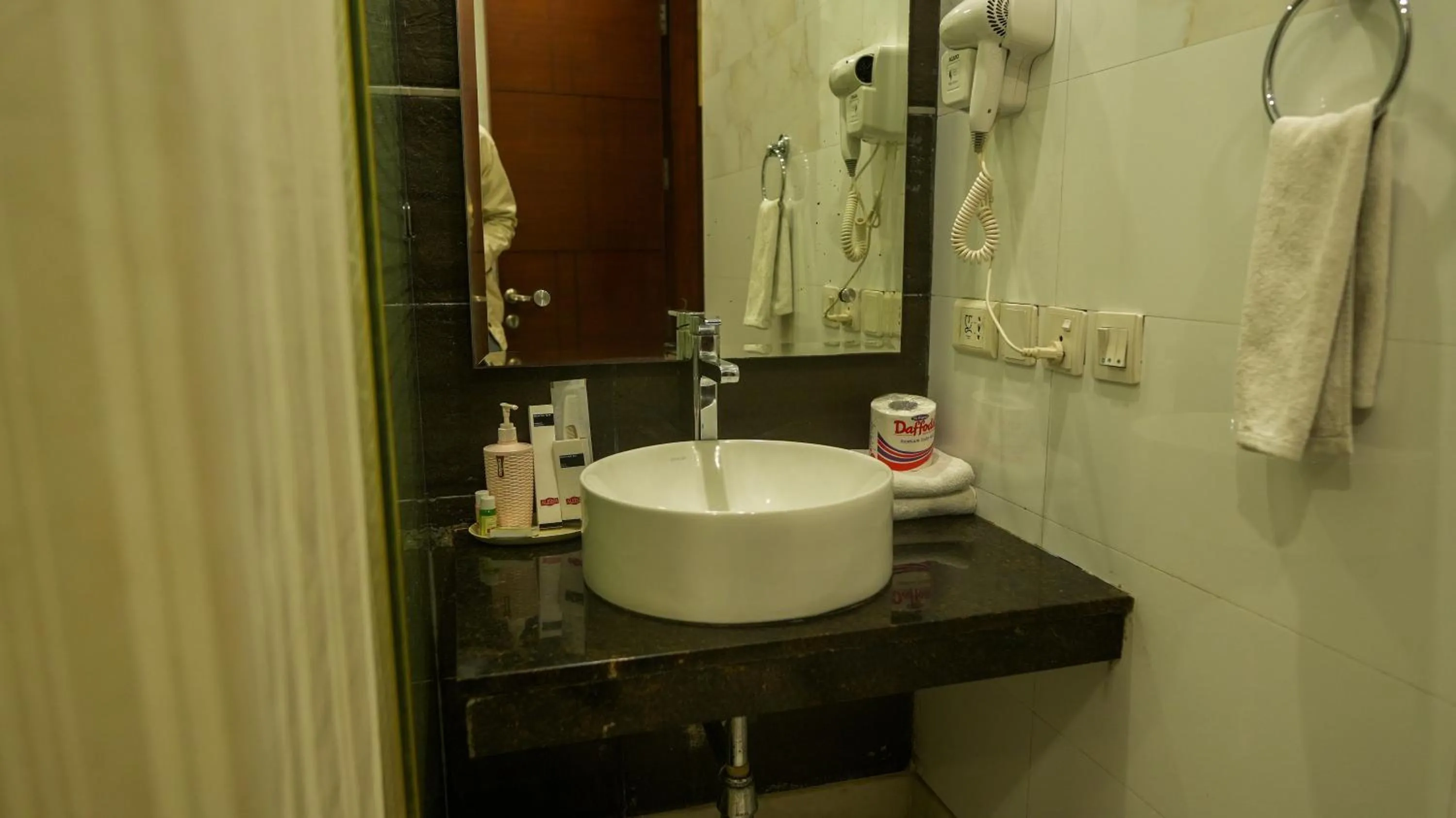 Bathroom in Alpina Hotels & Suites