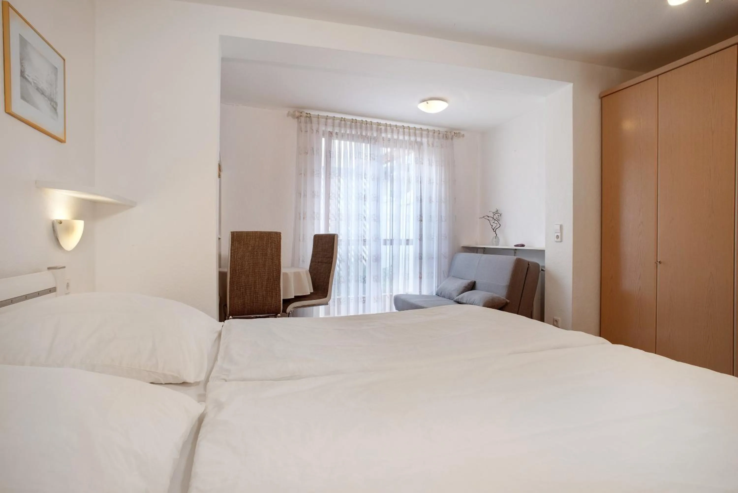 Living room, Bed in Hotel Garni Vitamari