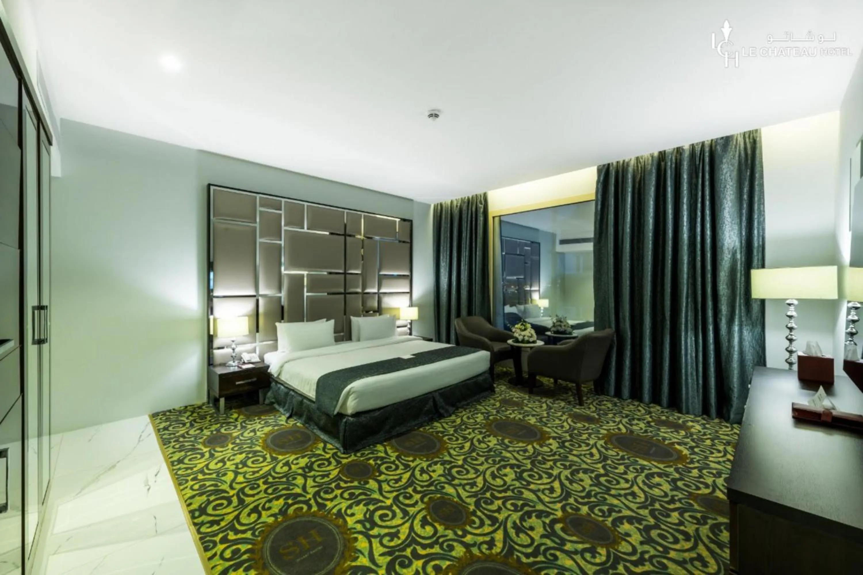 Bed in LeChateau Boutique Hotel