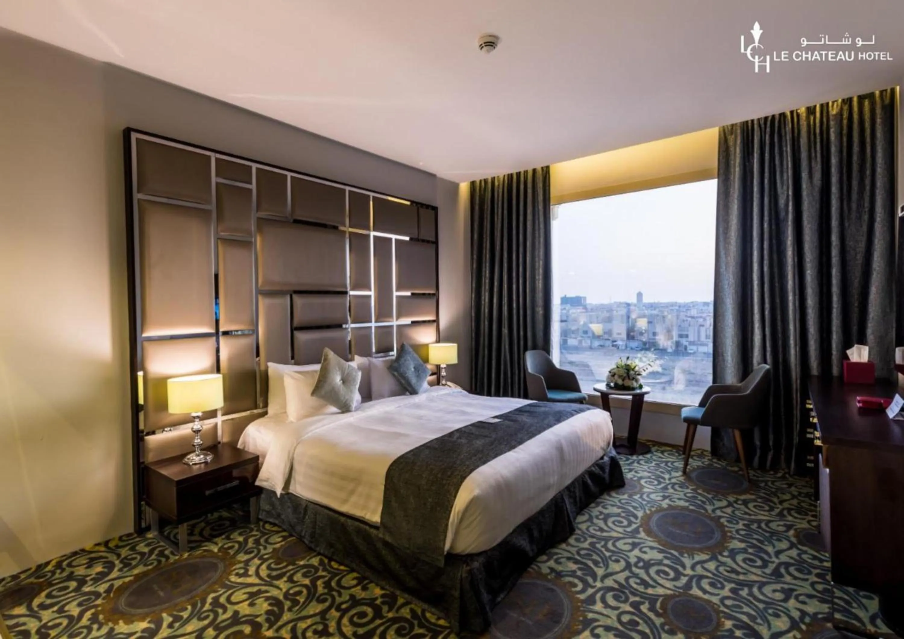 Bed in LeChateau Boutique Hotel