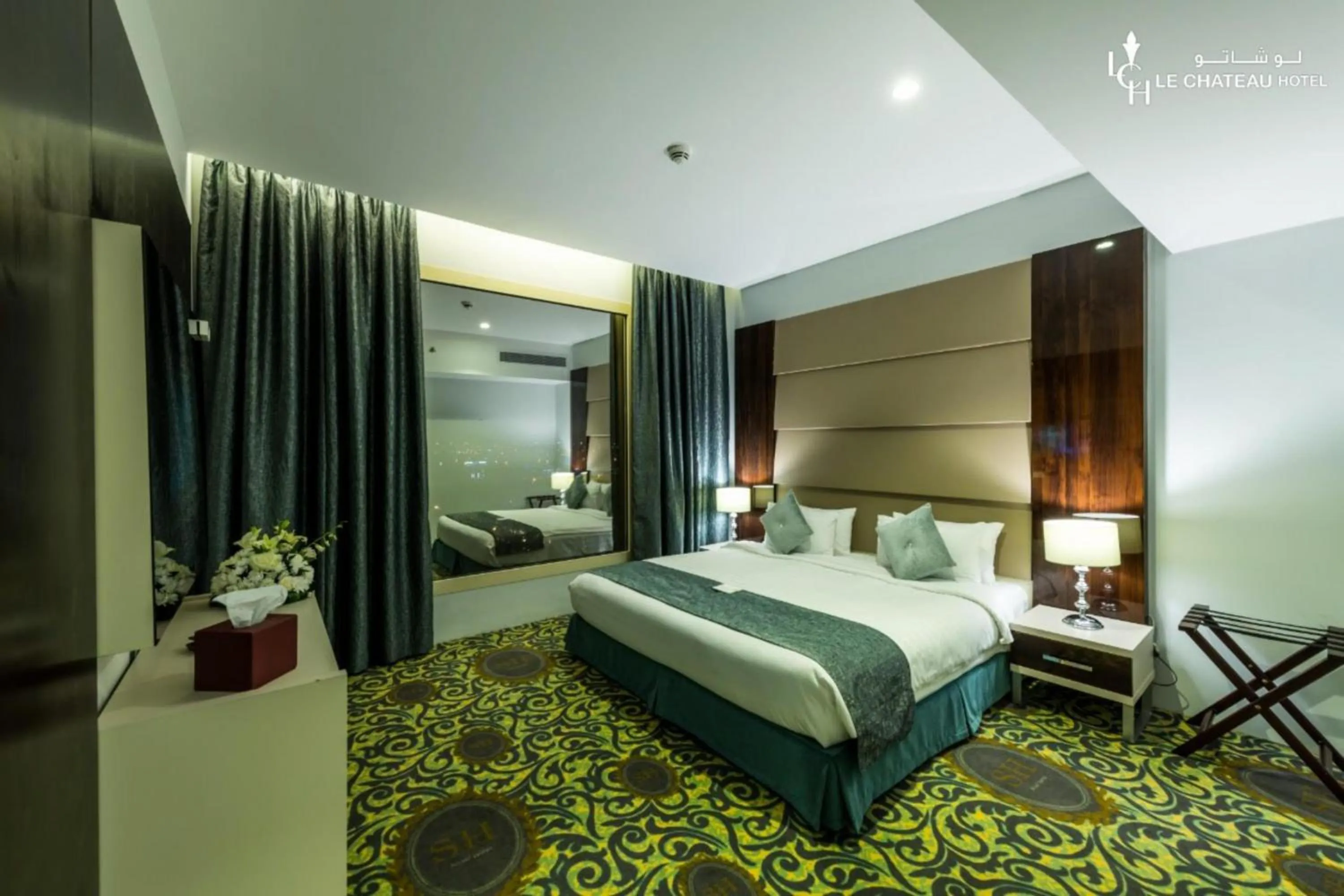 Bed in LeChateau Boutique Hotel