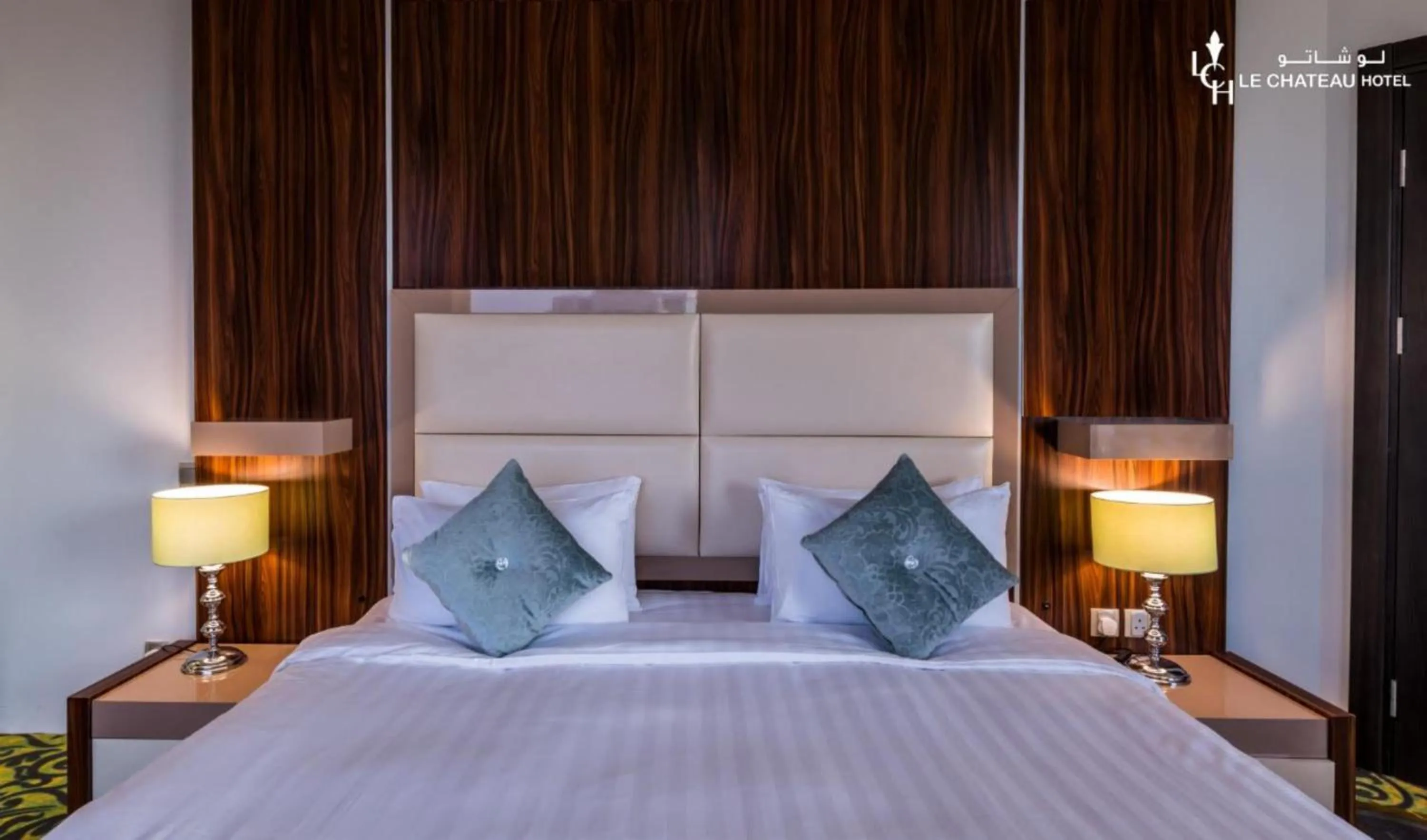 Bed in LeChateau Boutique Hotel