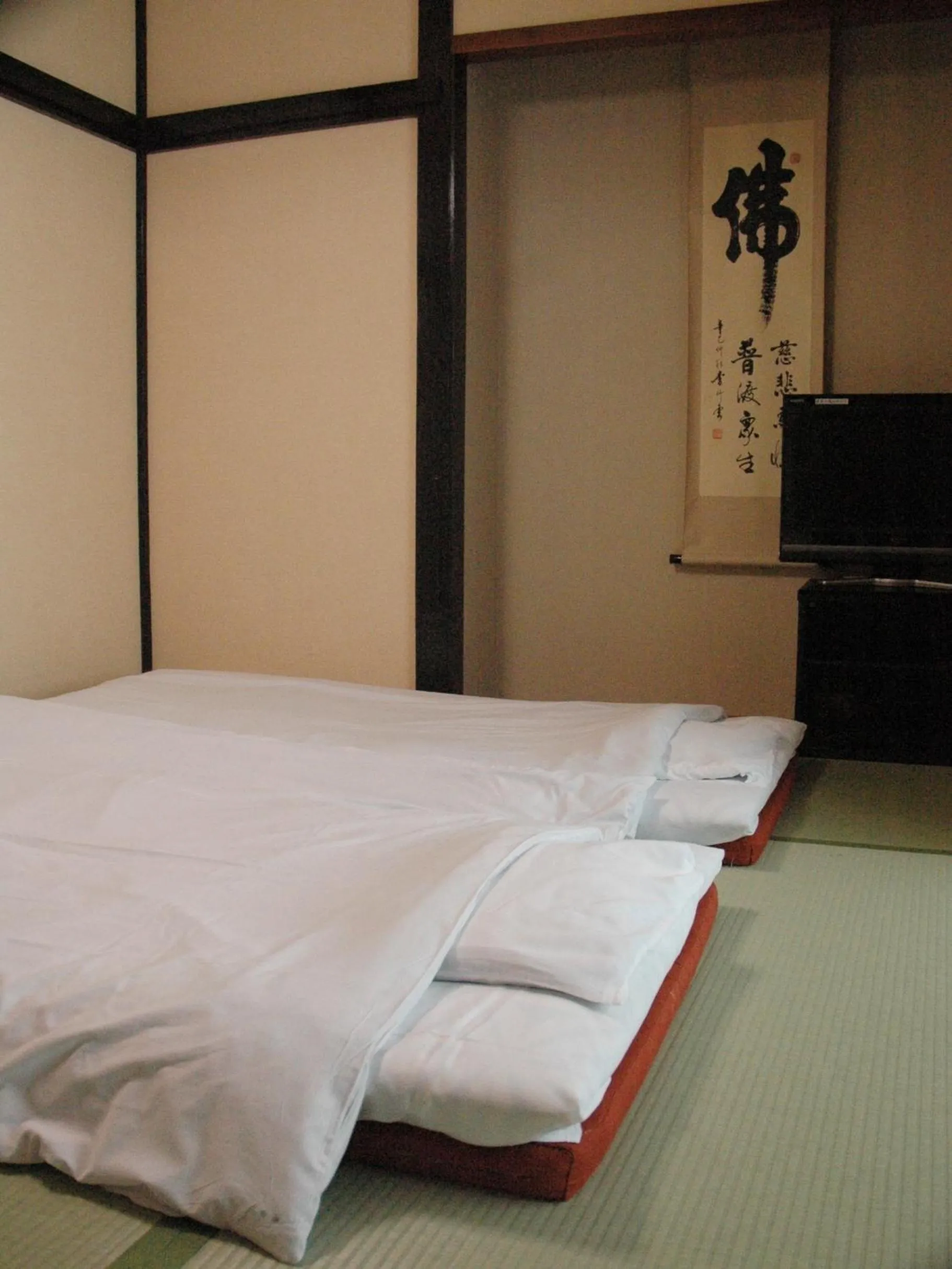 Bed in くさつのお宿 清重館 Kiyoshigekan 素泊りの宿