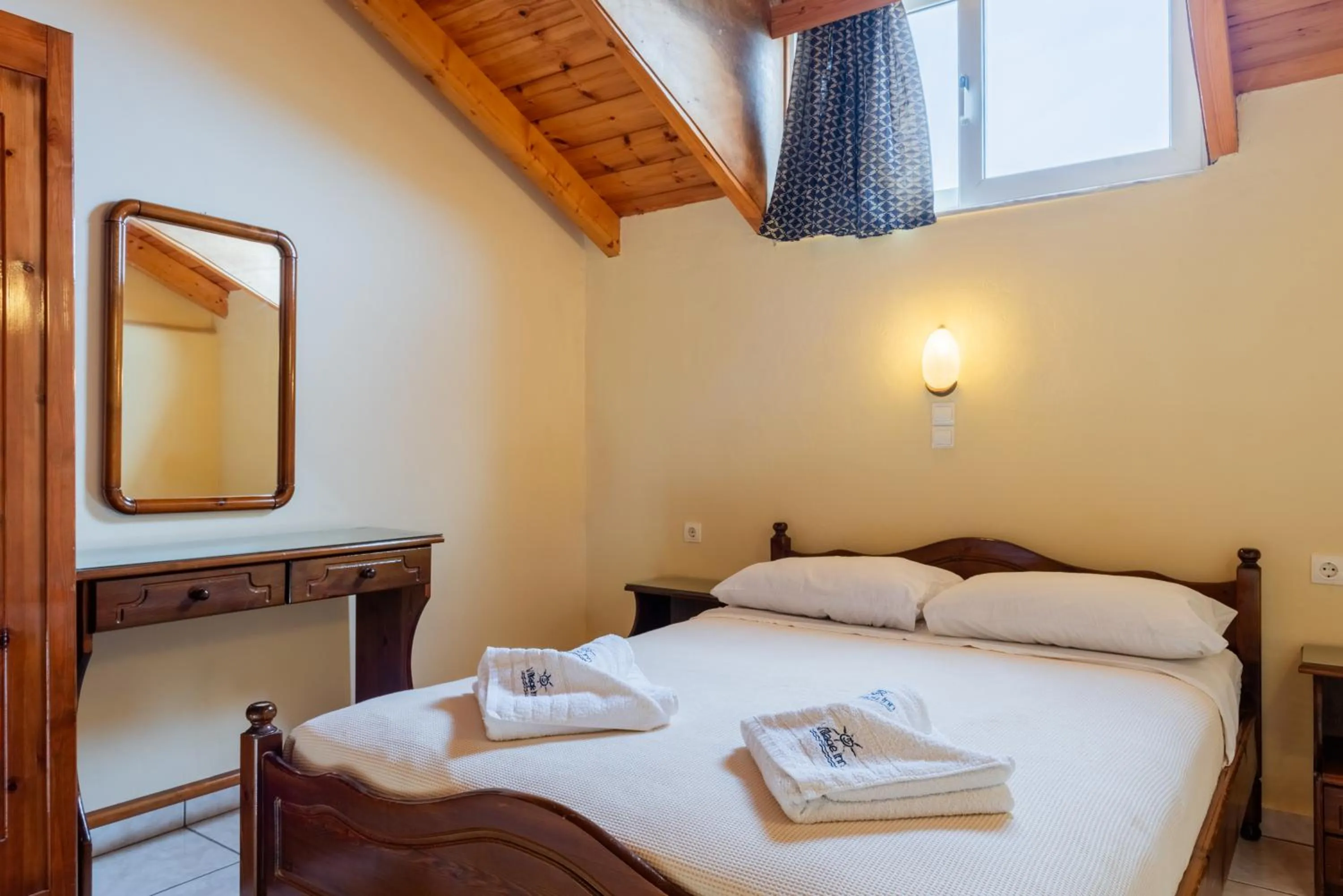 Bed in Village Inn Studios & Family Apartments