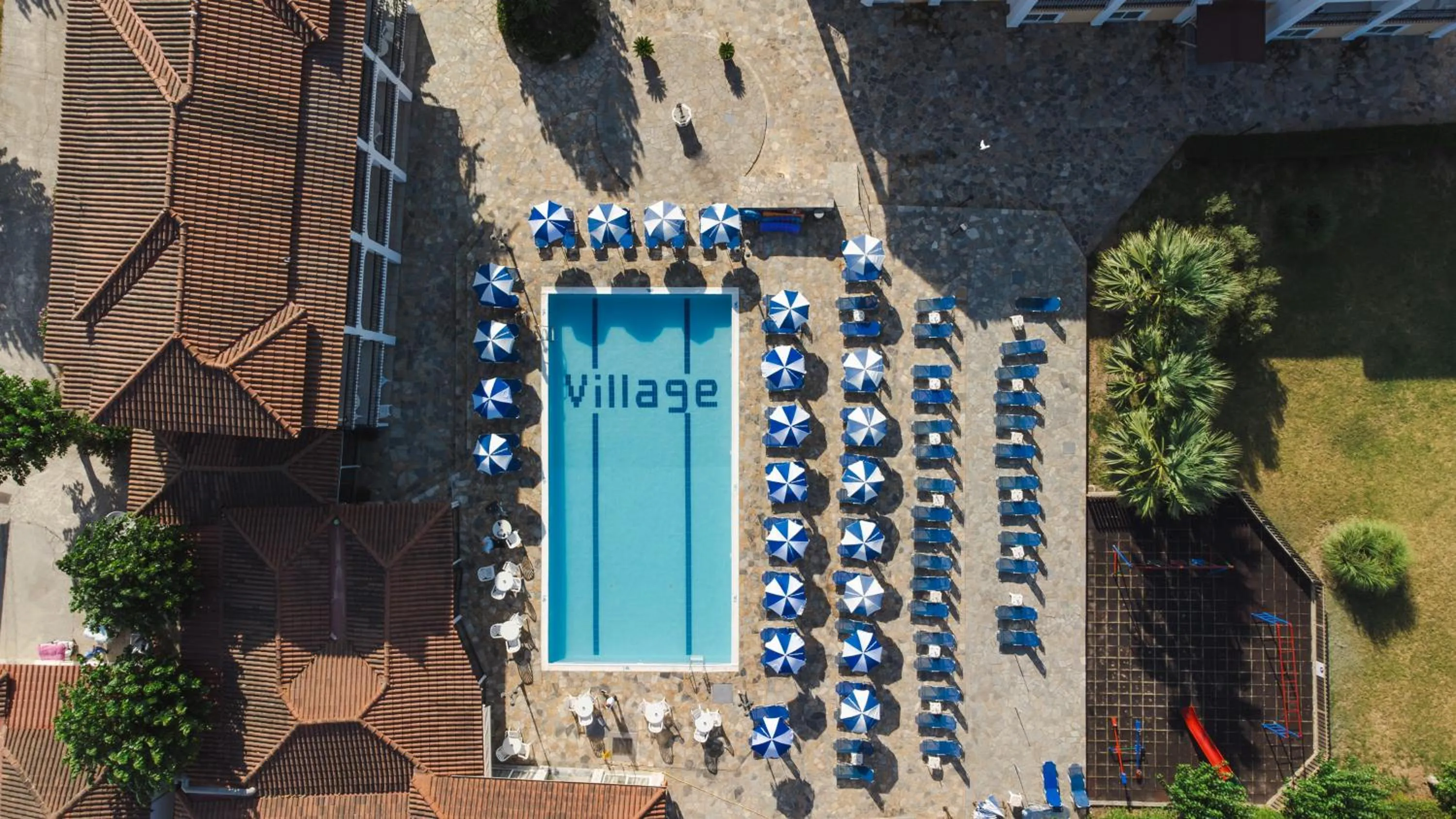 Swimming pool in Village Inn Studios & Family Apartments