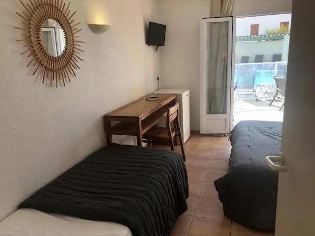 Bed in Hotel Le Bleu Marine