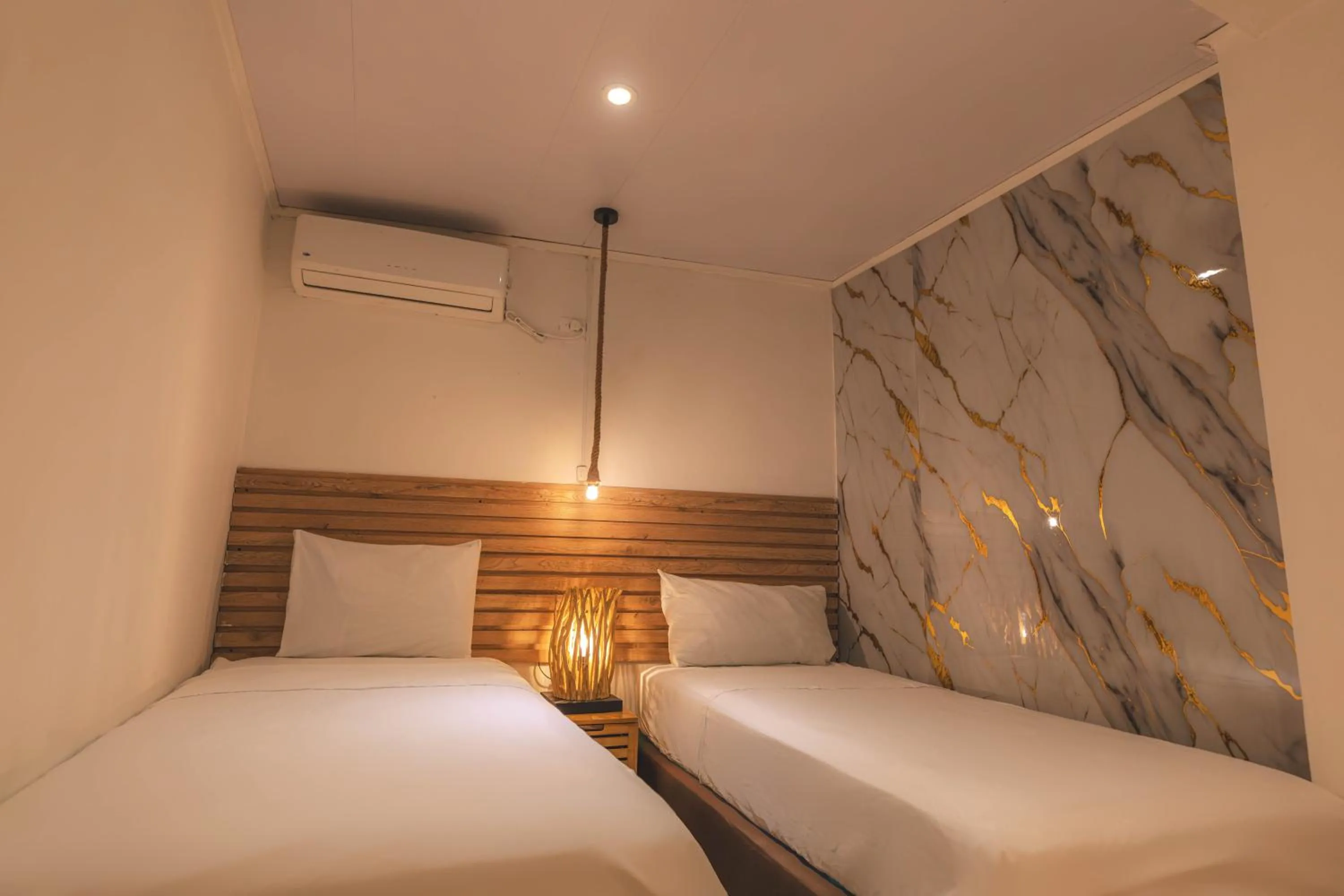 Bed in Ataraxy Hotel Boutique