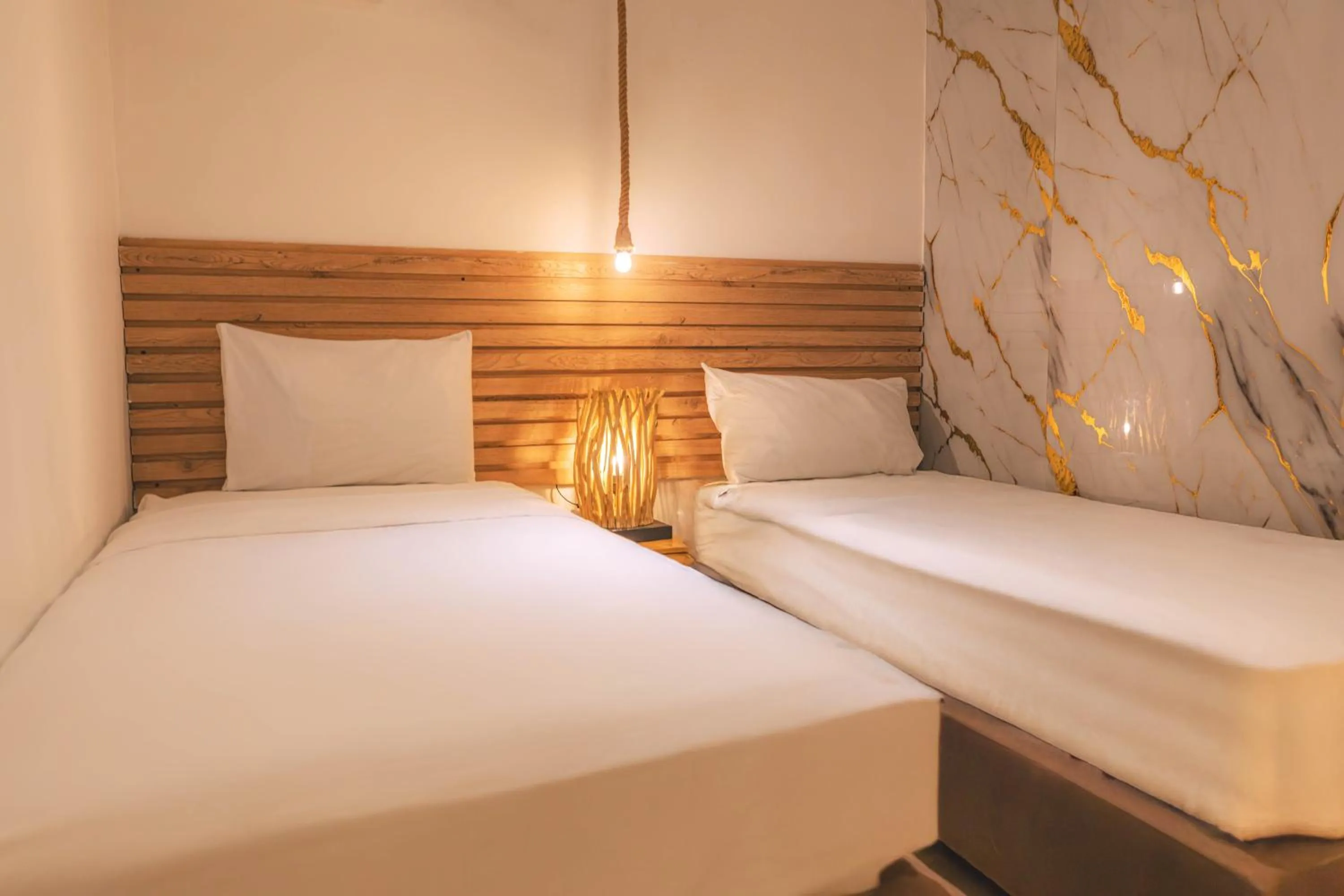 Bed in Ataraxy Hotel Boutique