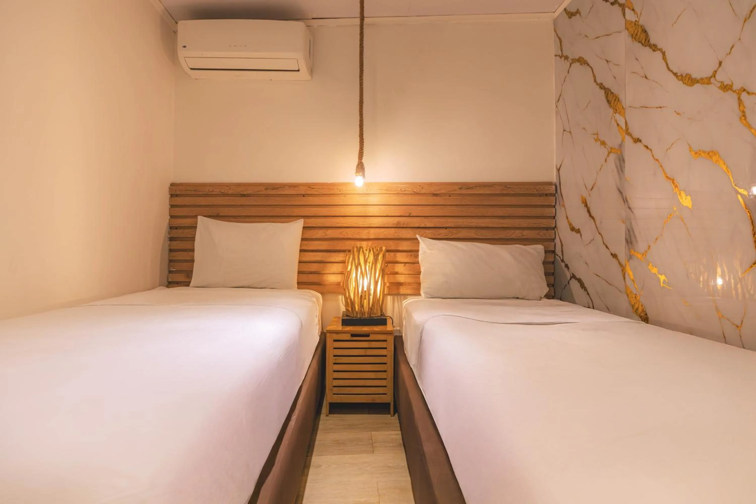 Bed in Ataraxy Hotel Boutique