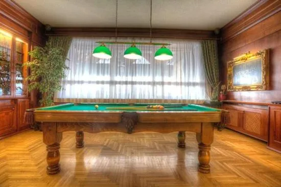 Communal lounge/ TV room in Grand Boutique Hotel