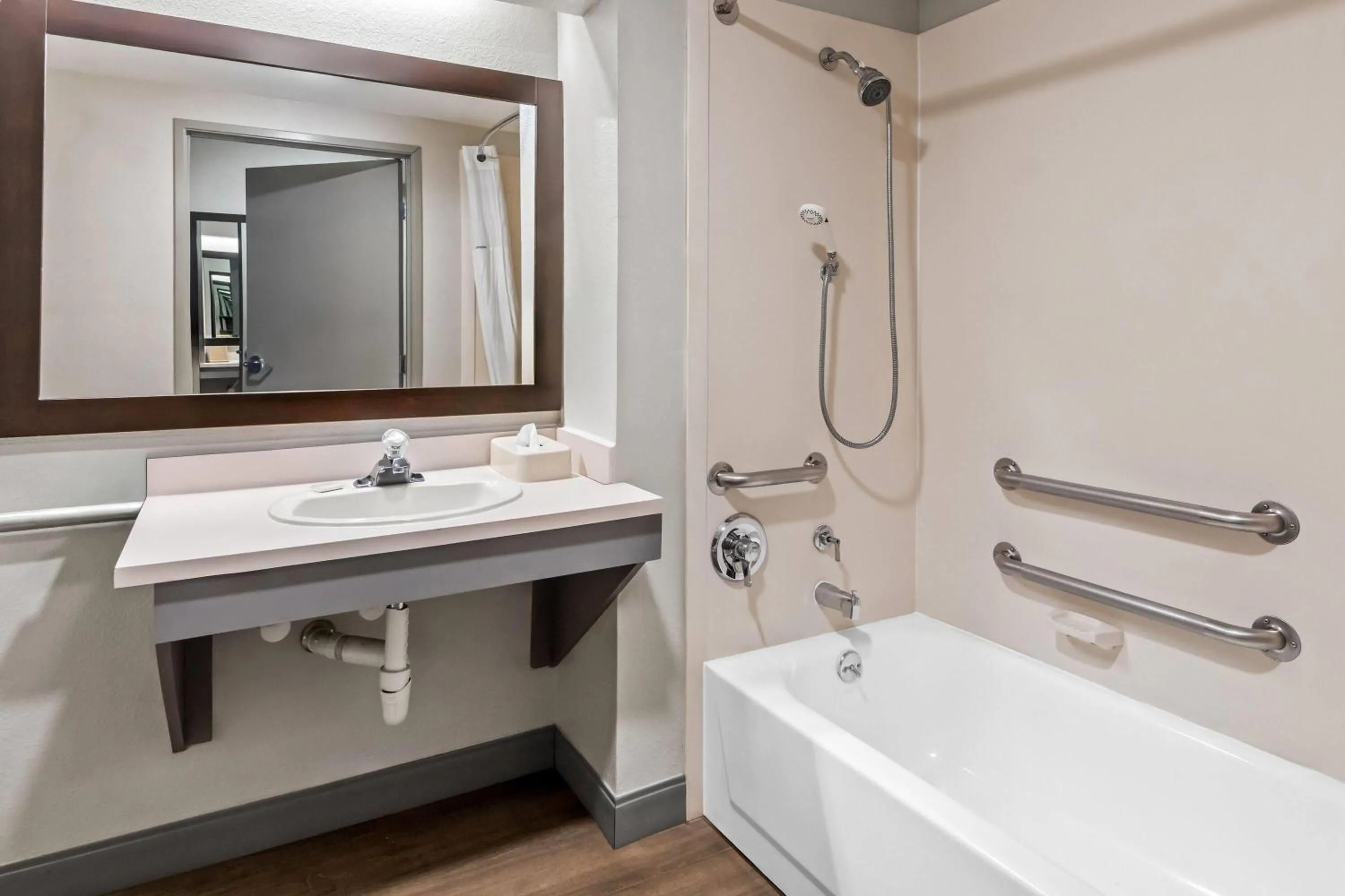 Bathroom in Days Inn & Suites by Wyndham DeSoto