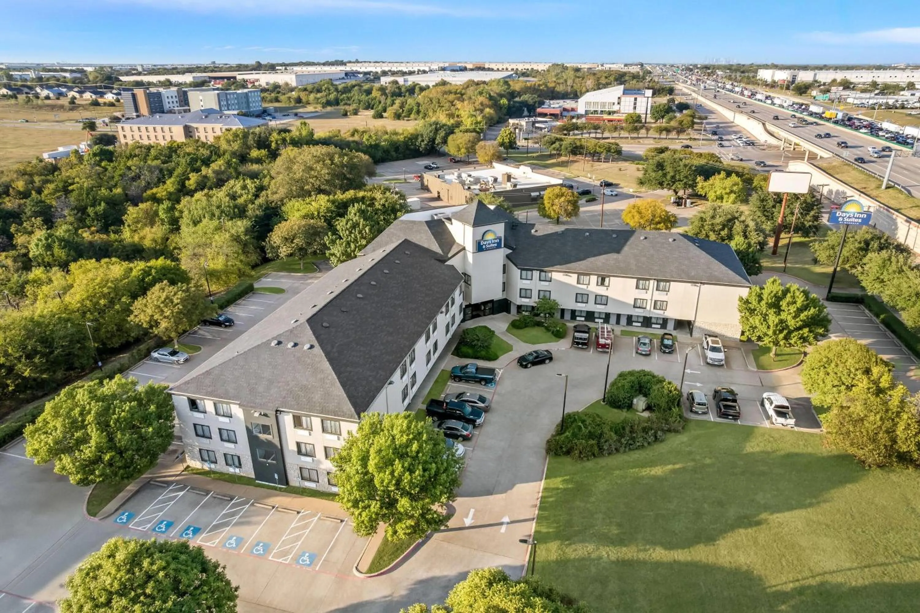 Property building in Days Inn & Suites by Wyndham DeSoto