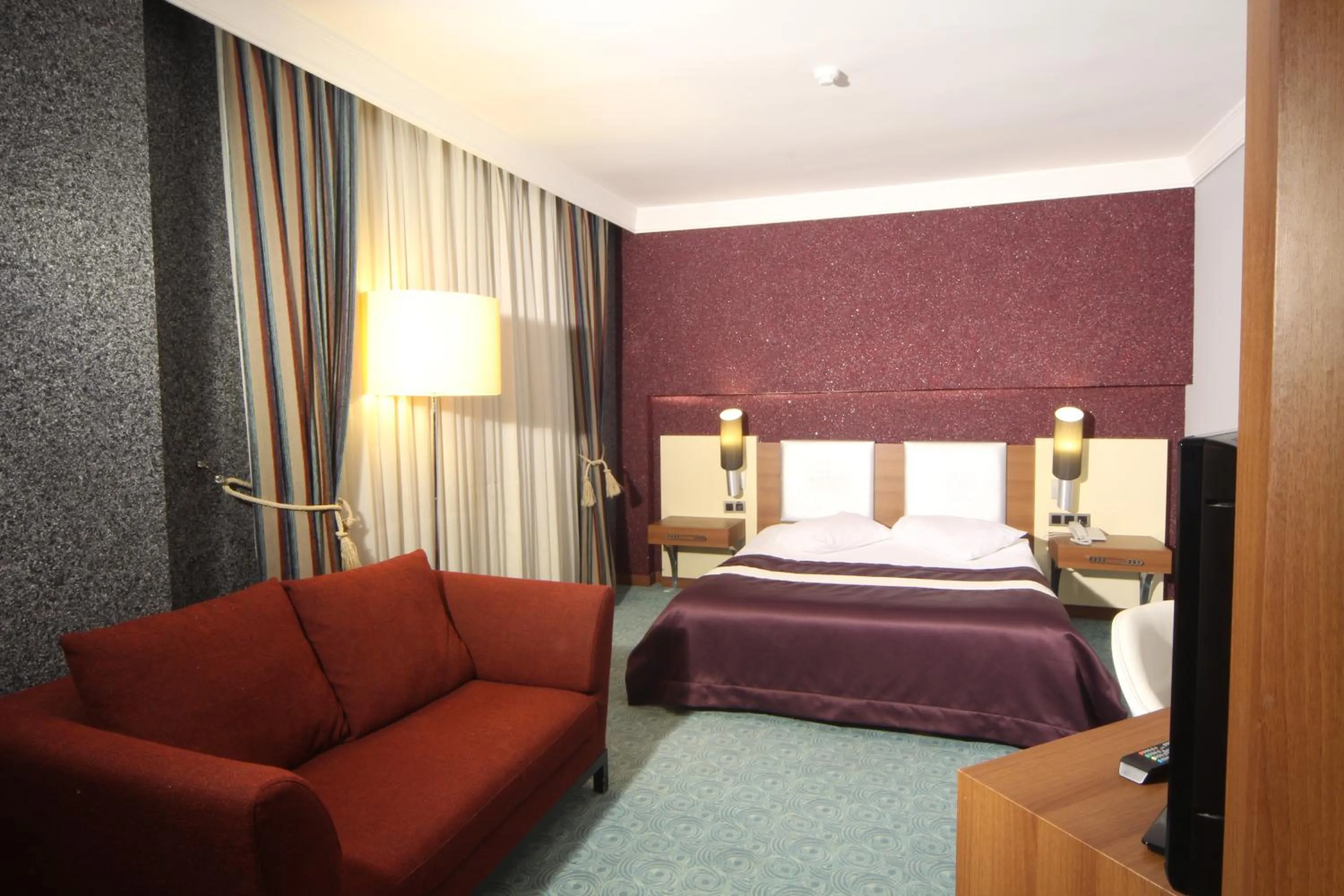 Bed in Suhan Cappadocia Hotel & Spa