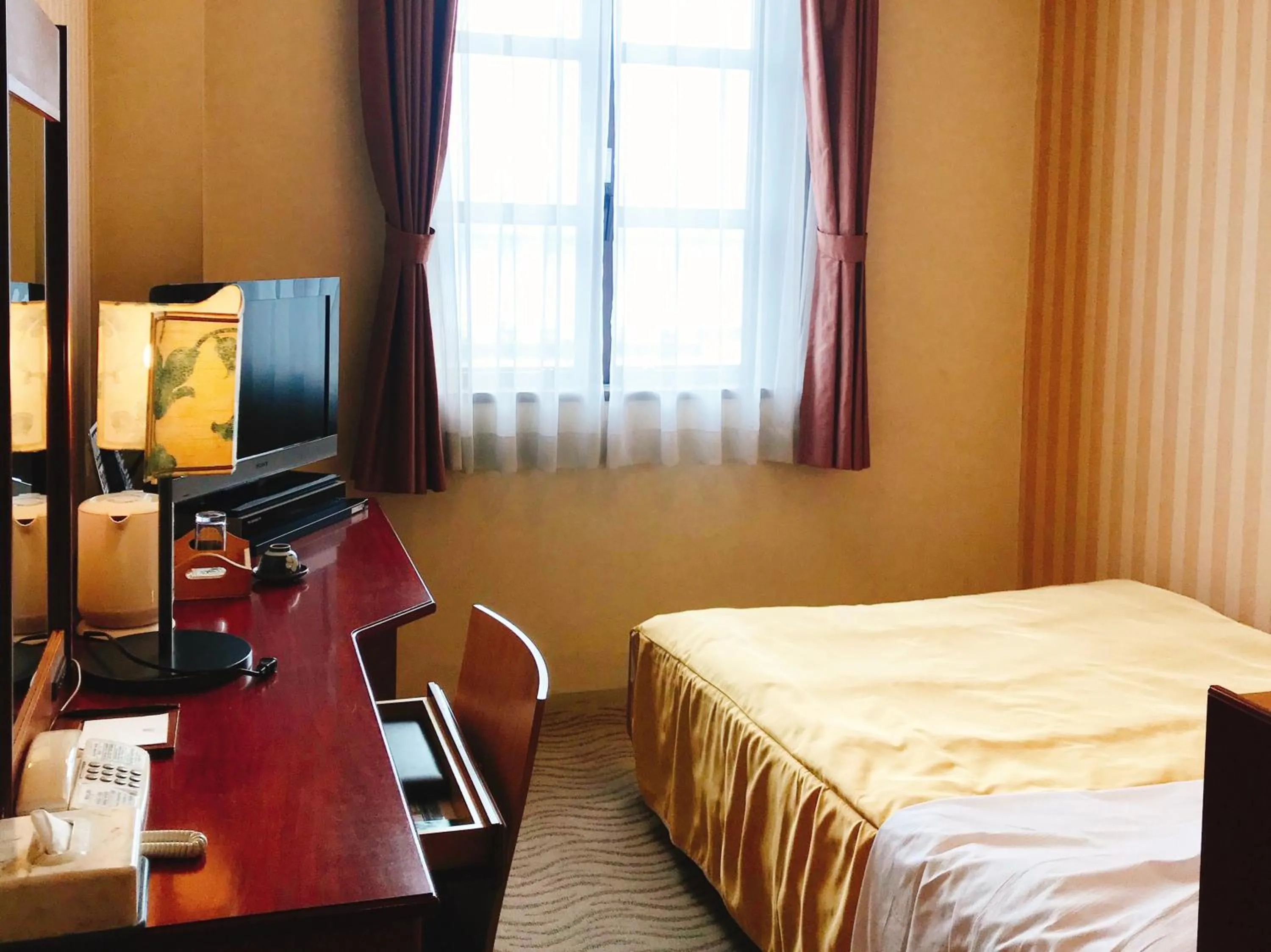 Bed in Kitabiwako Hotel Grazie