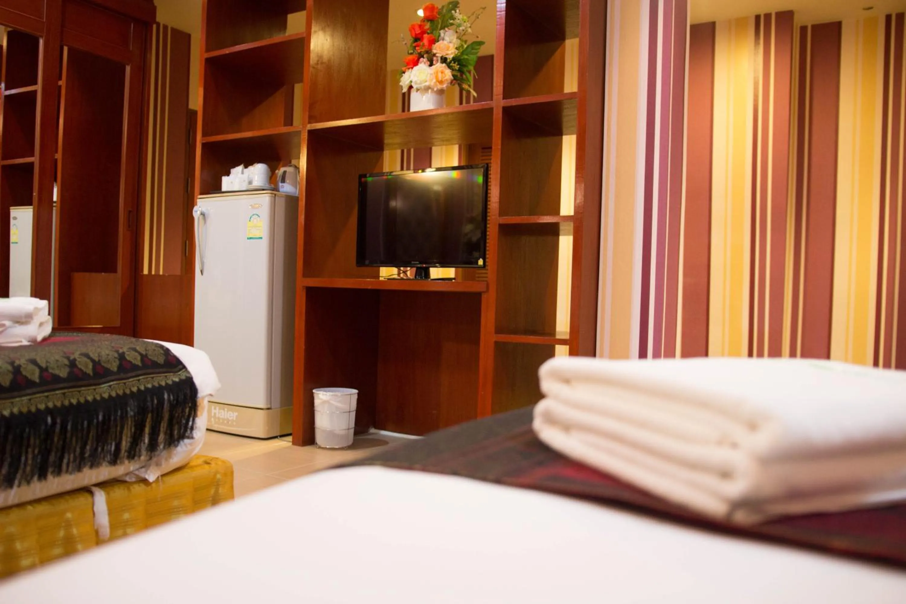 Bed in Natural Samui Hotel