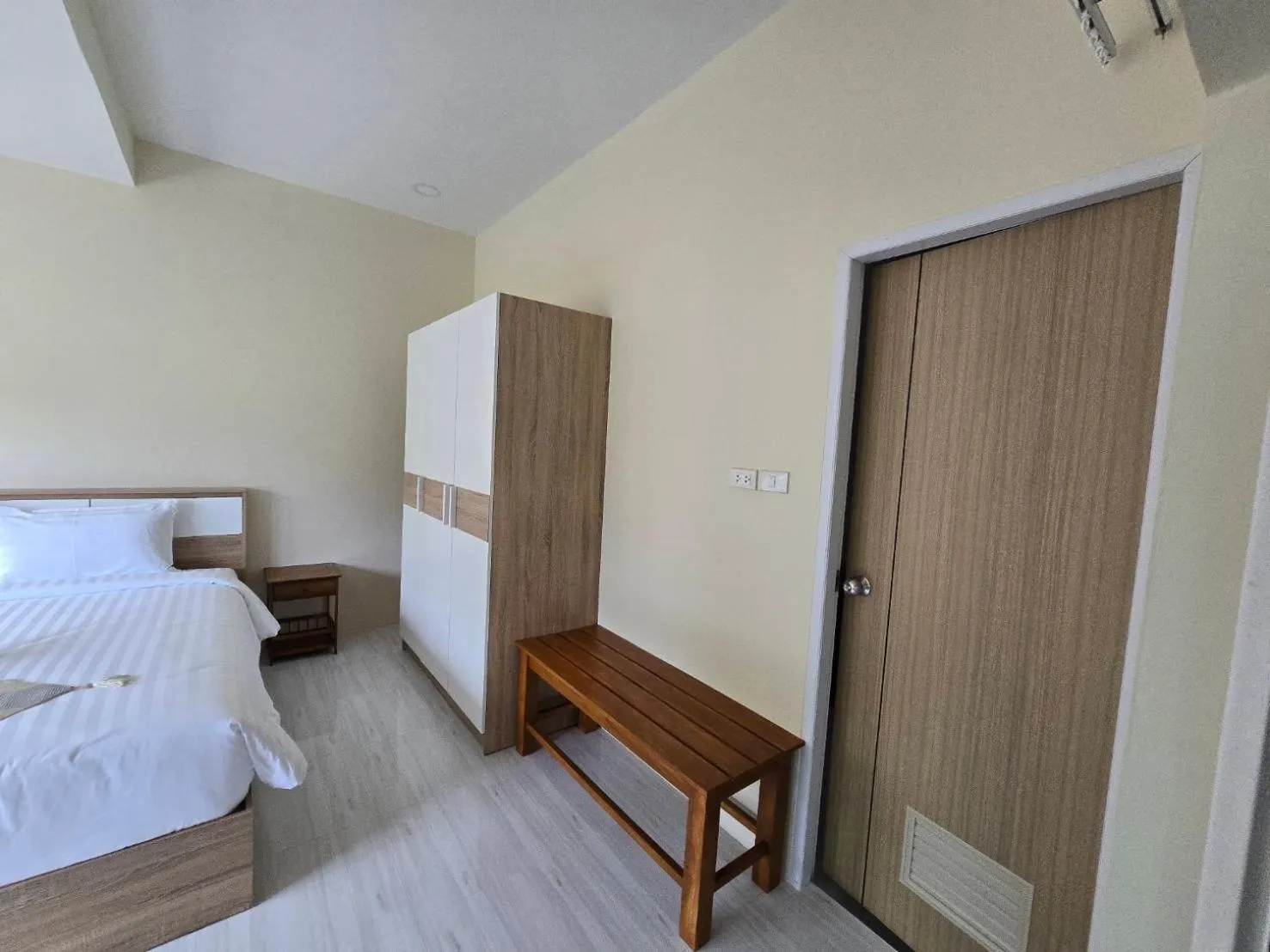 Bed in Natural Samui Hotel