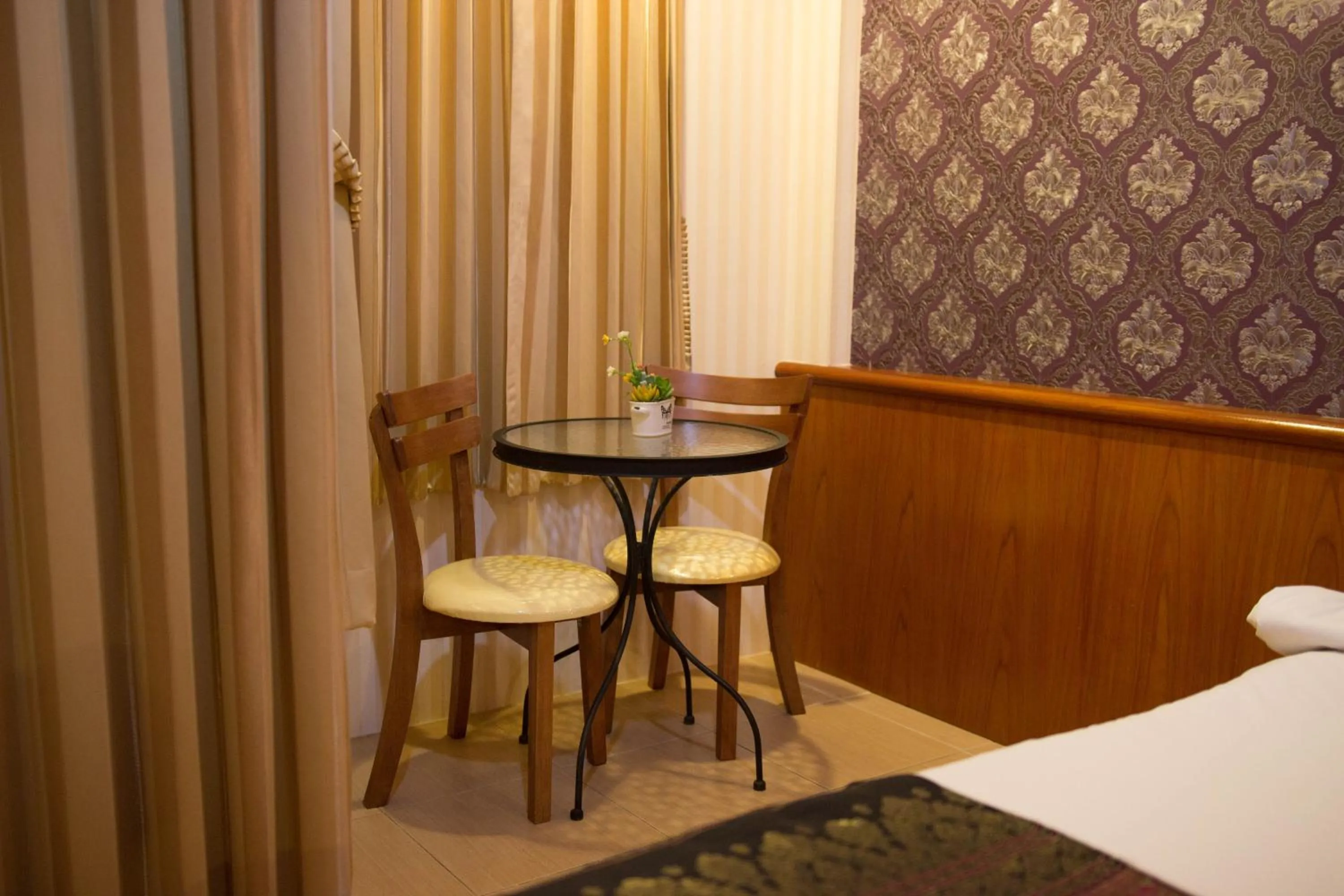 Bed in Natural Samui Hotel