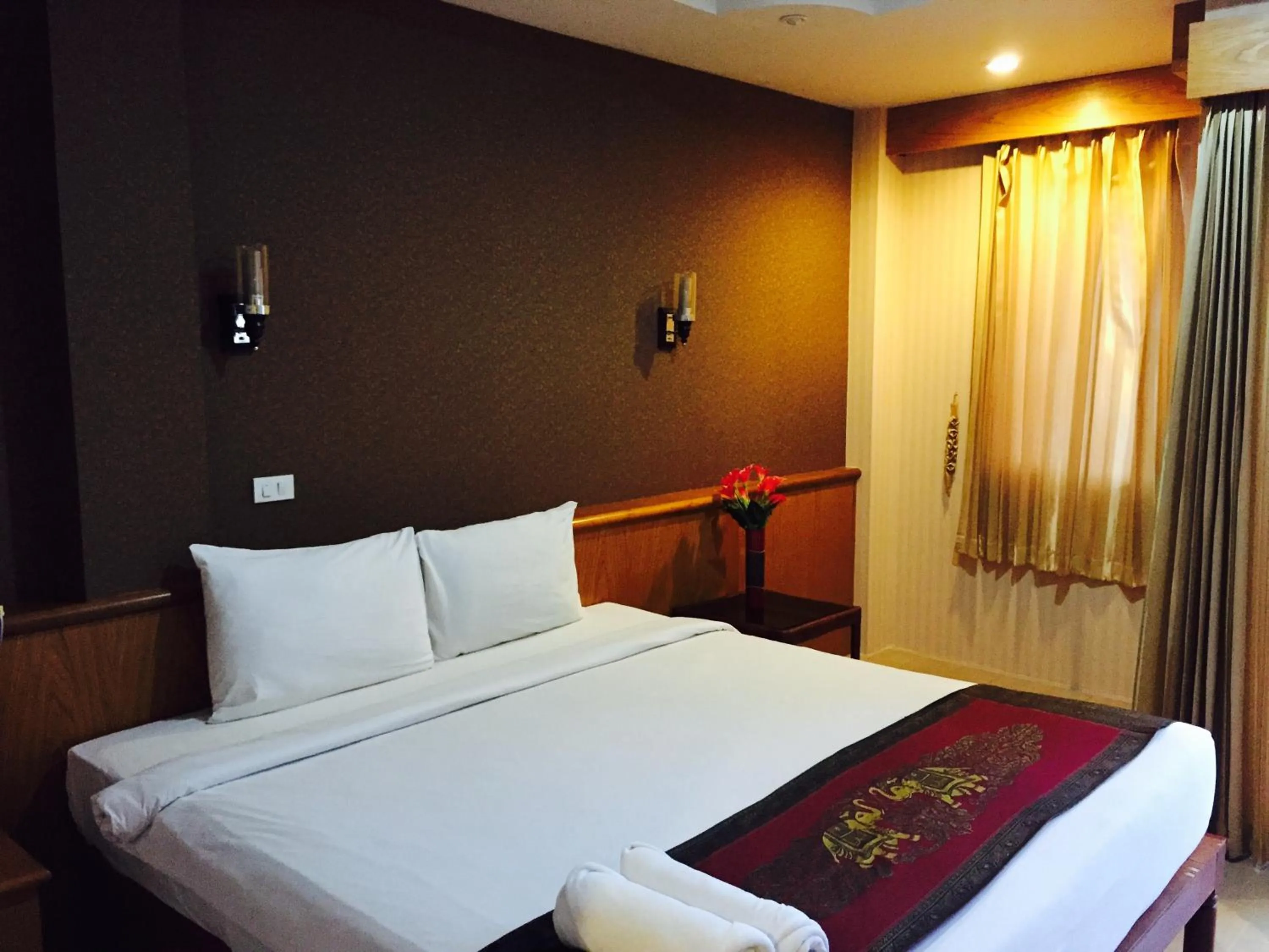 Bed in Natural Samui Hotel