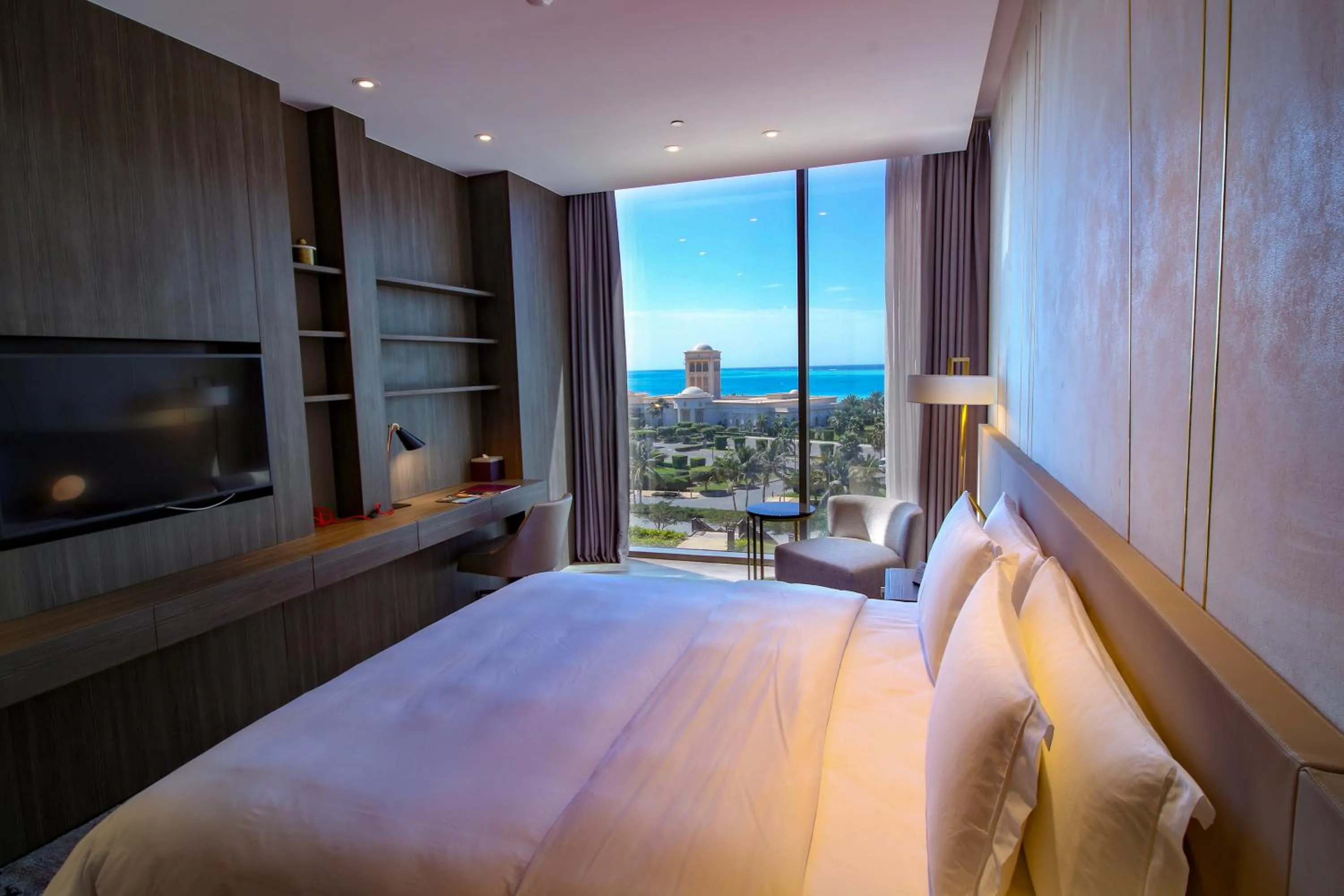 Seating area, Bed in Views Hotel & Residences - Emaar King Abdullah Economic City