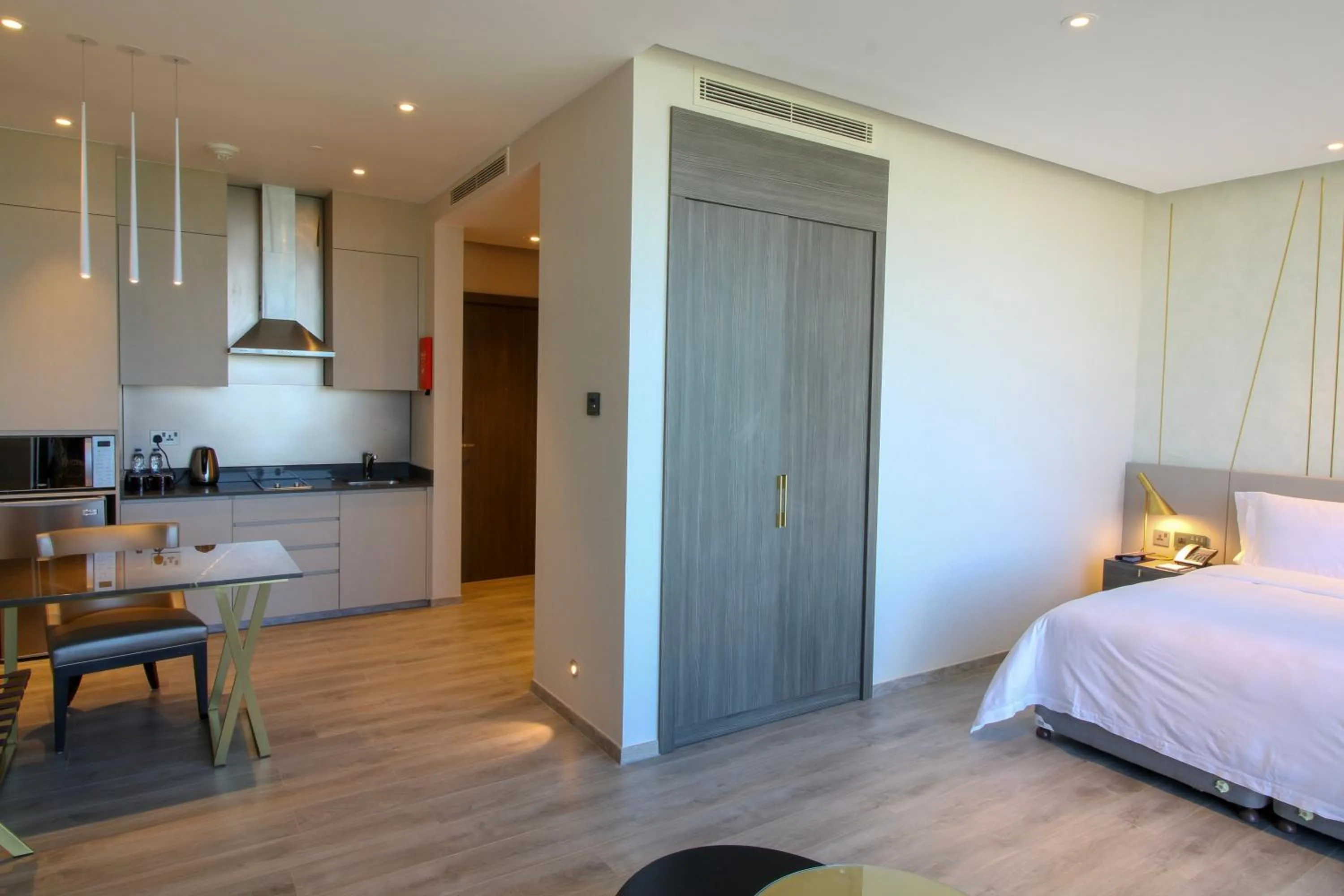 Kitchen or kitchenette, Bed in Views Hotel & Residences - Emaar King Abdullah Economic City