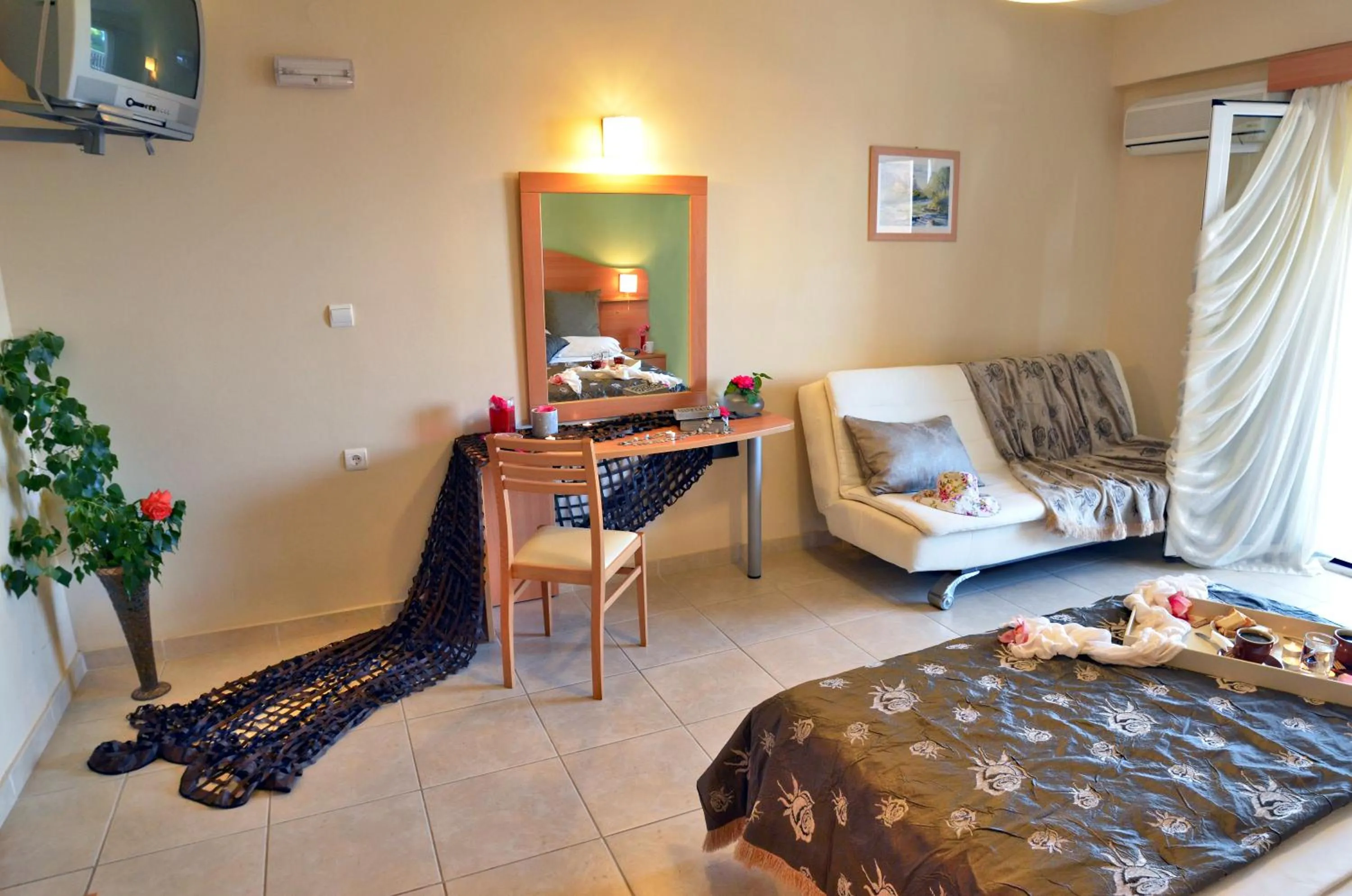 Bed in Belussi Beach Hotel & Suites