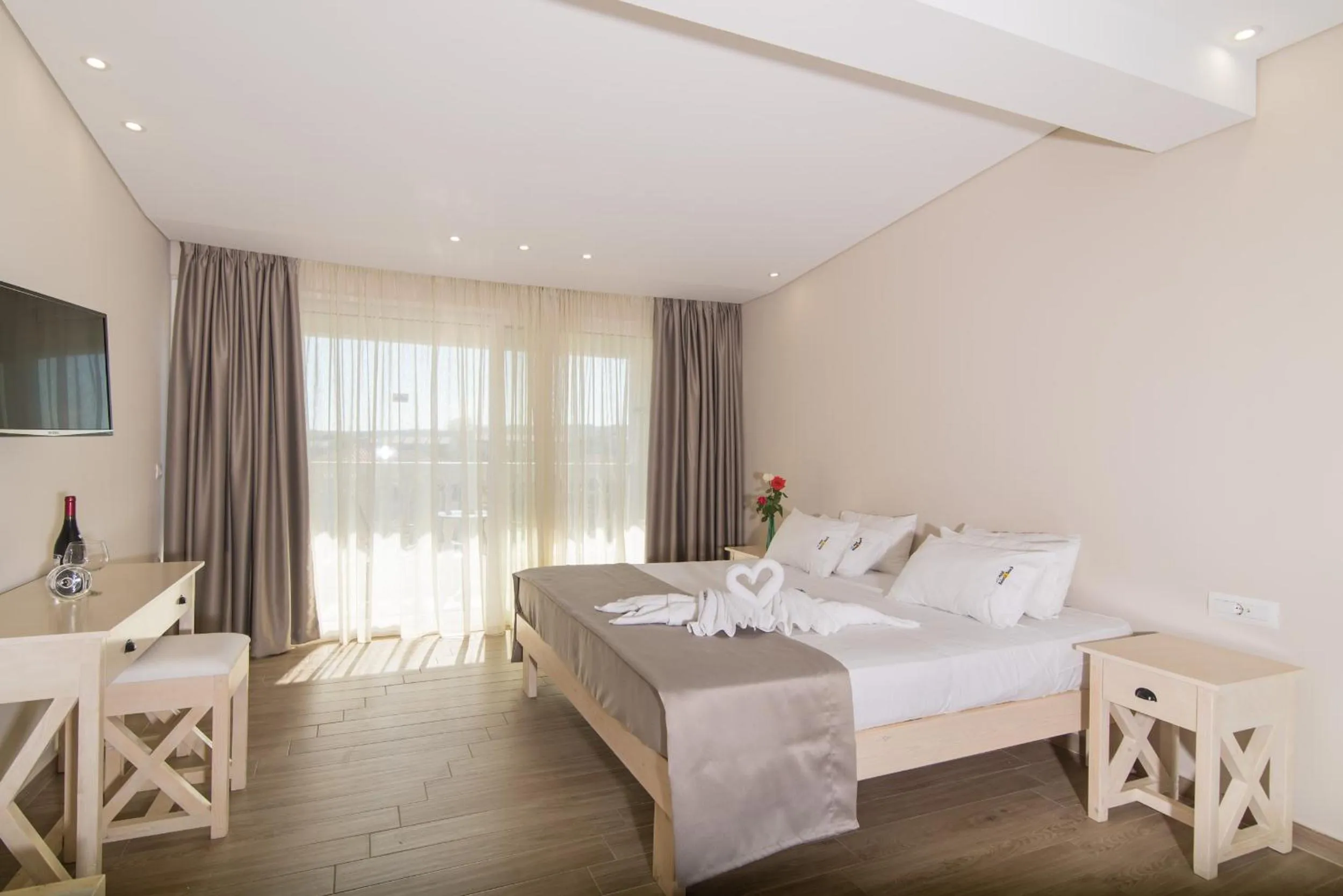 Bedroom in Belussi Beach Hotel & Suites