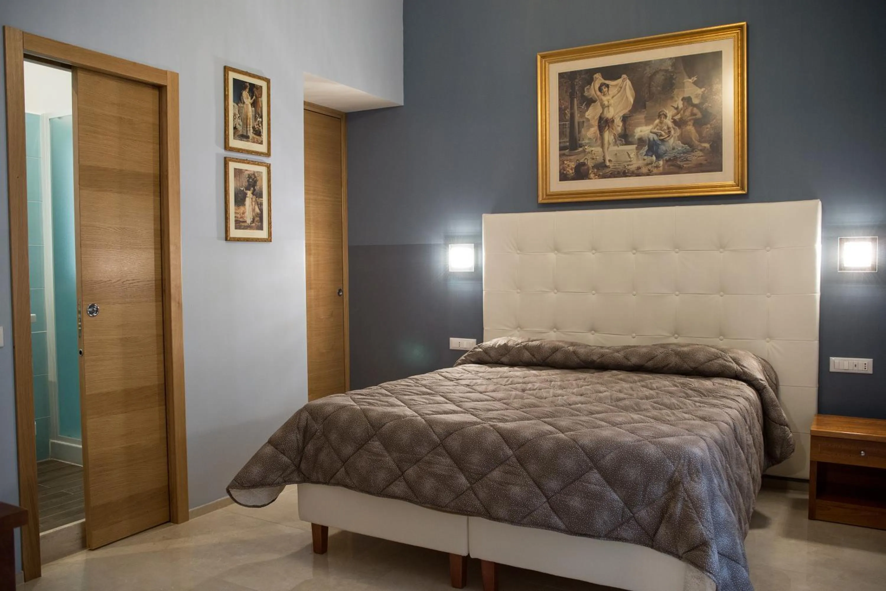 Bed in La Residenza Suites