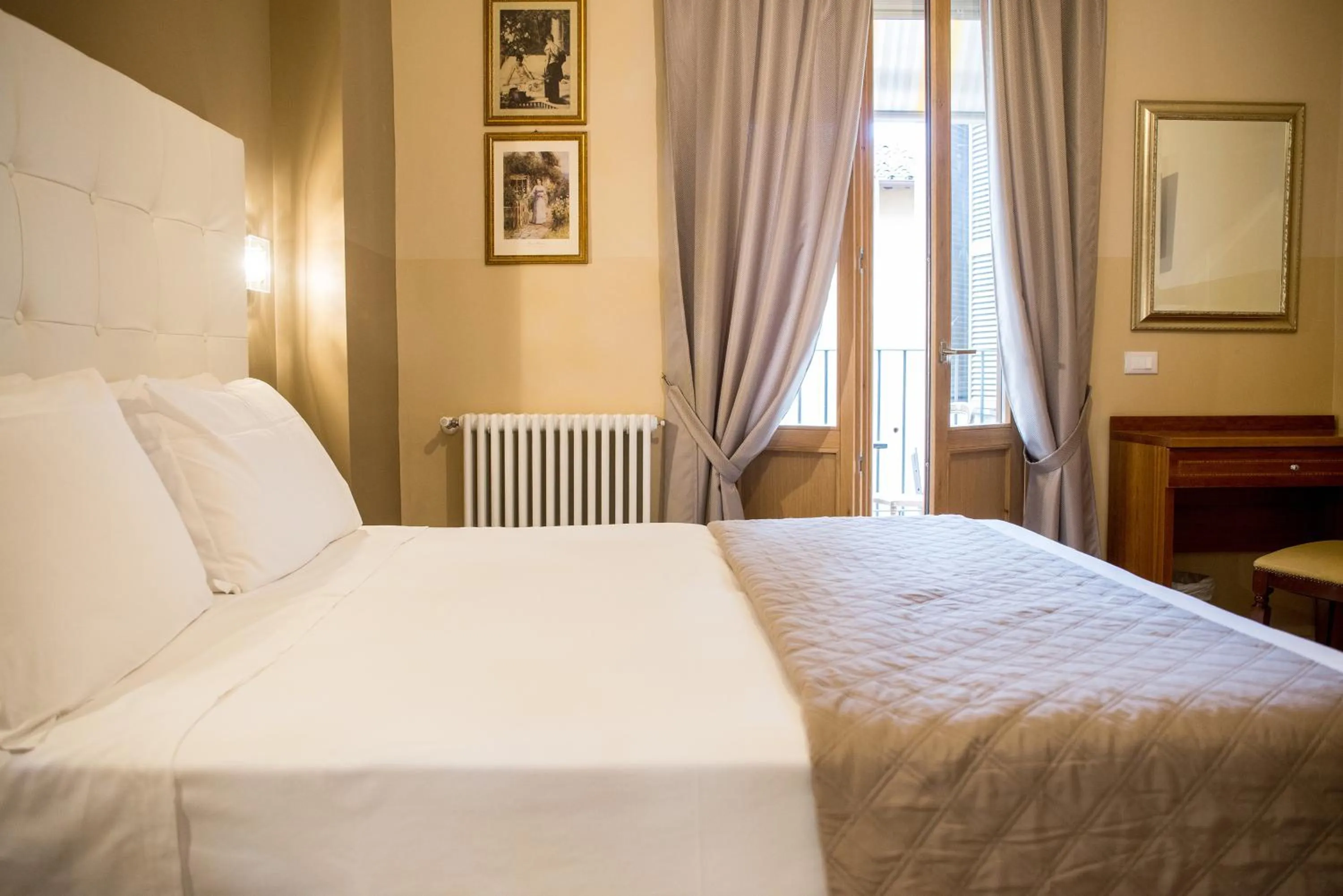 Bed in La Residenza Suites