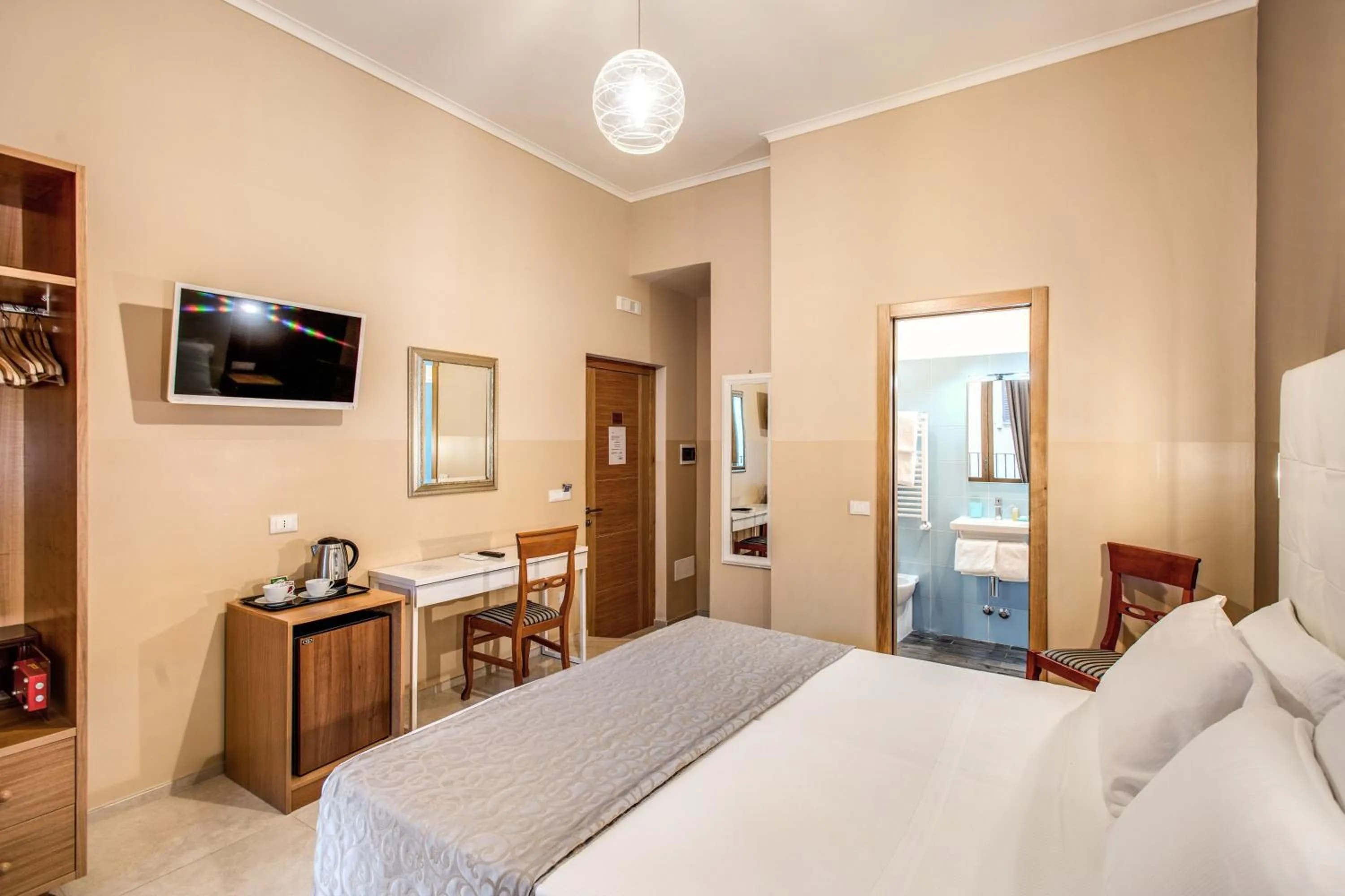 Bed in La Residenza Suites