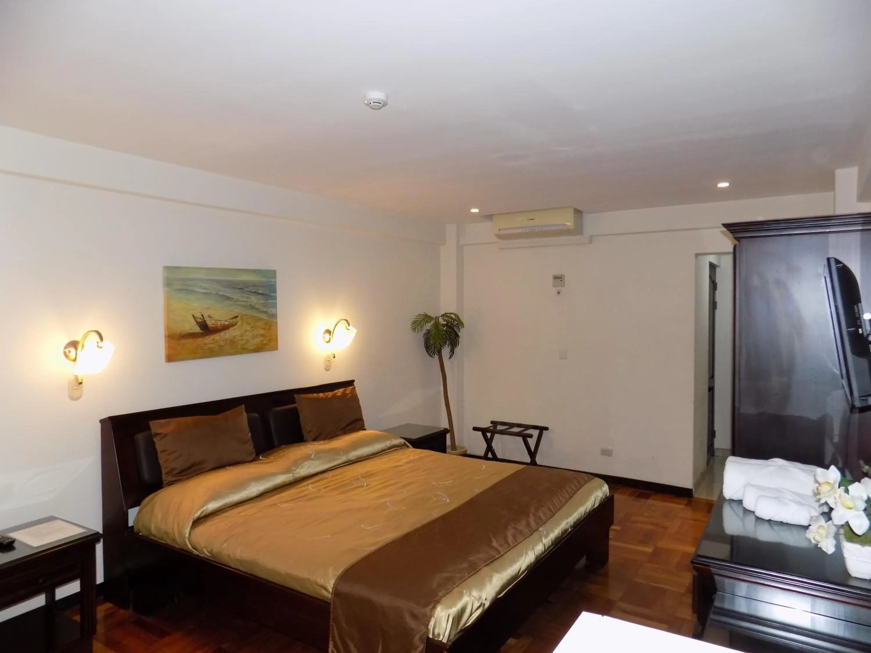 Bed in Hotel Plaza Real Suites & Apartments San Jose