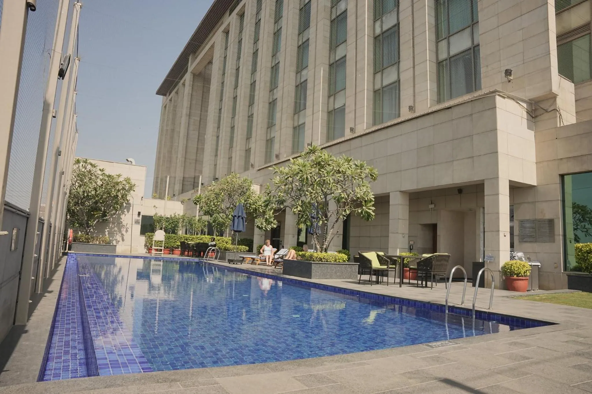 Swimming pool in Crowne Plaza New Delhi Okhla by IHG