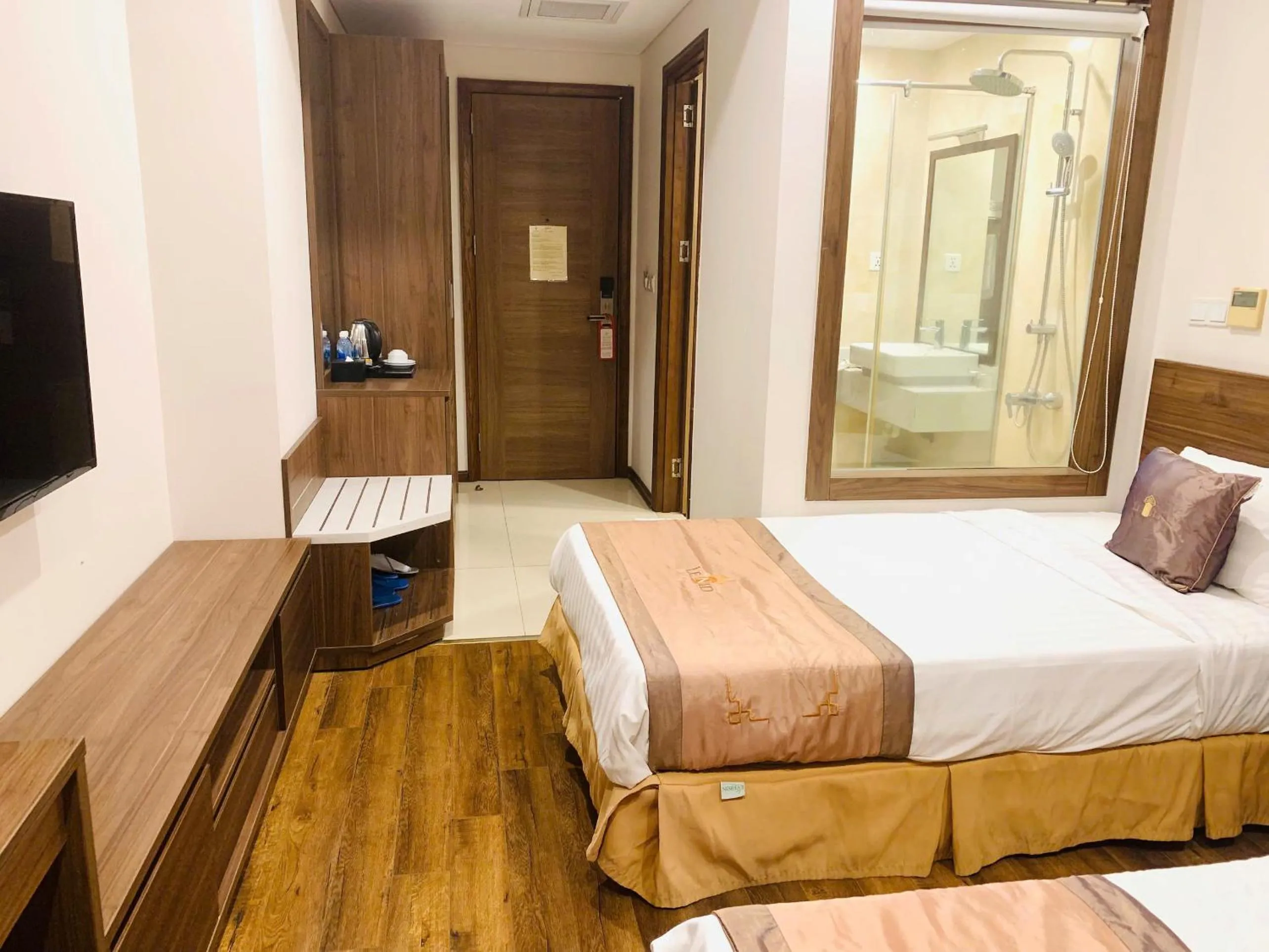 Communal lounge/ TV room, Bed in Lenid Ocean View Hotel