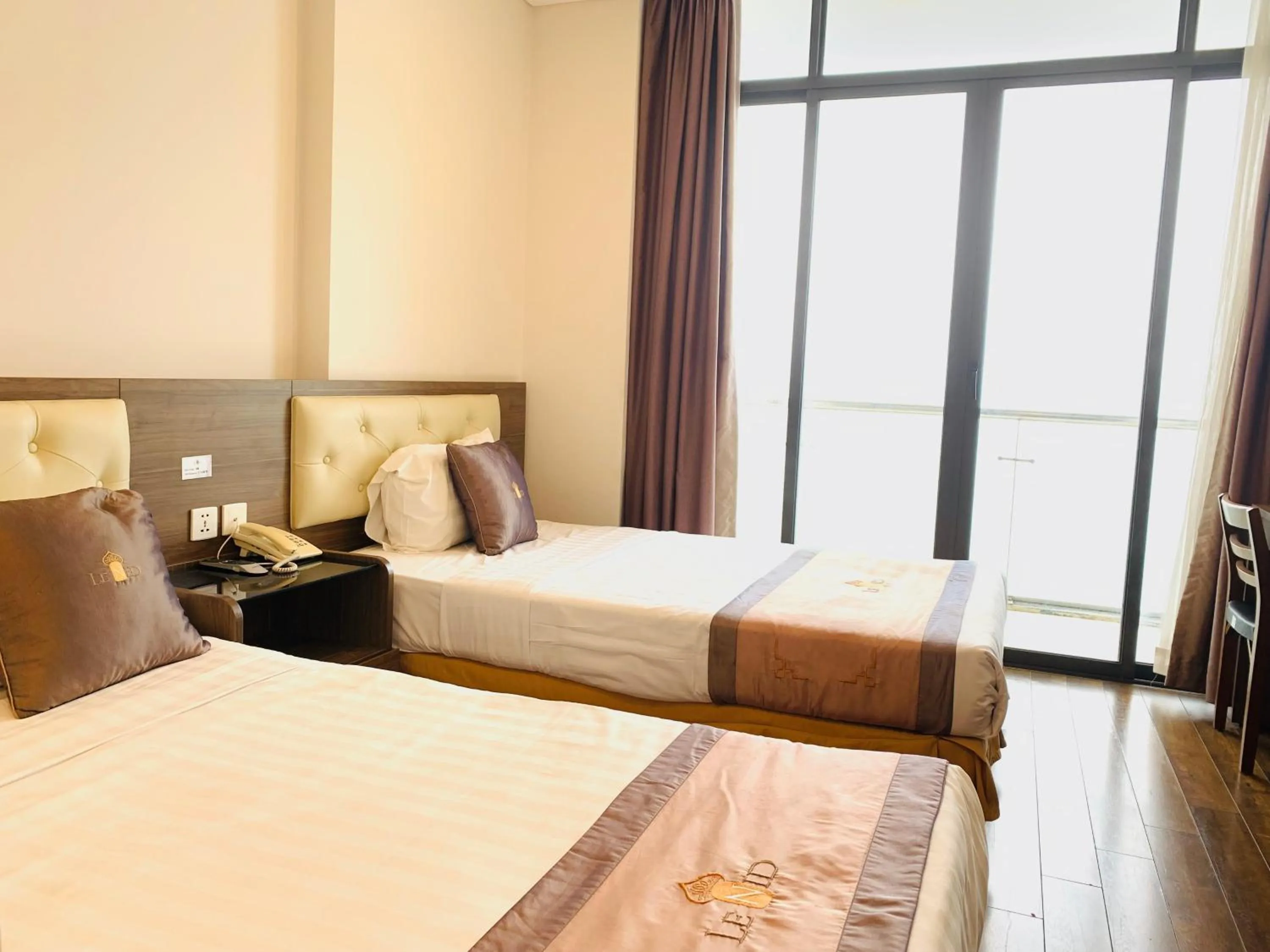 Bed in Lenid Ocean View Hotel