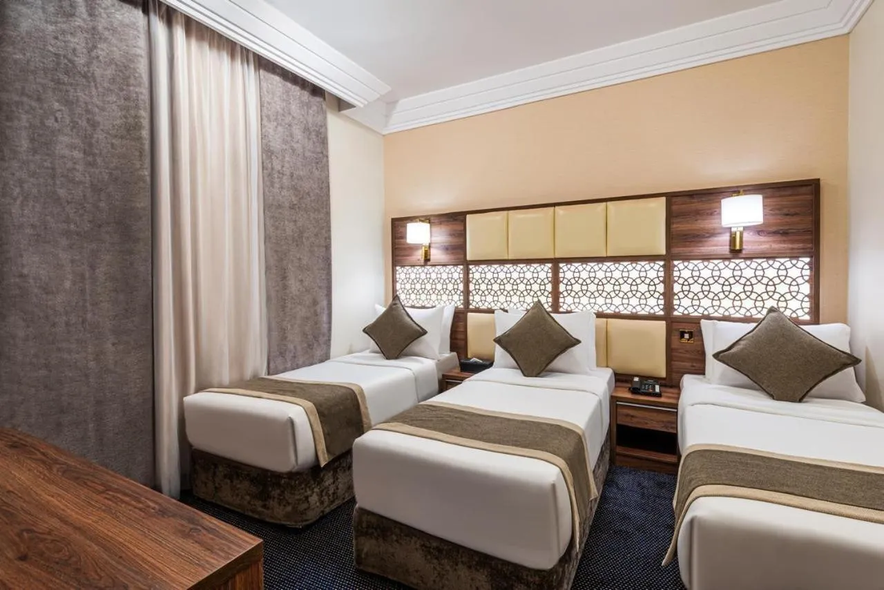 Photo of the whole room, Bed in Golden Tulip Al-Zahabi