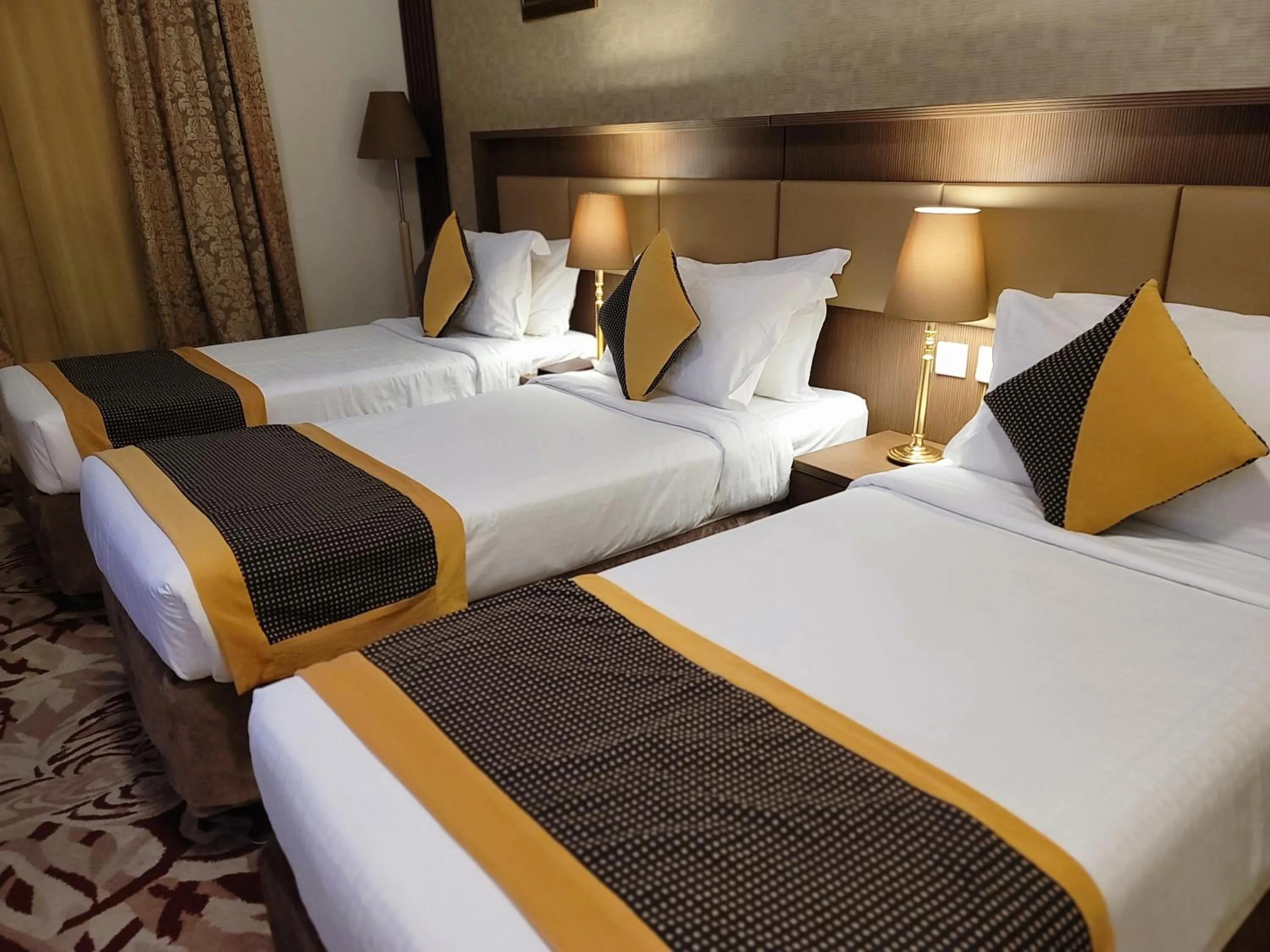 Bed in Al Ansar Palace Golden Tulip Hotel